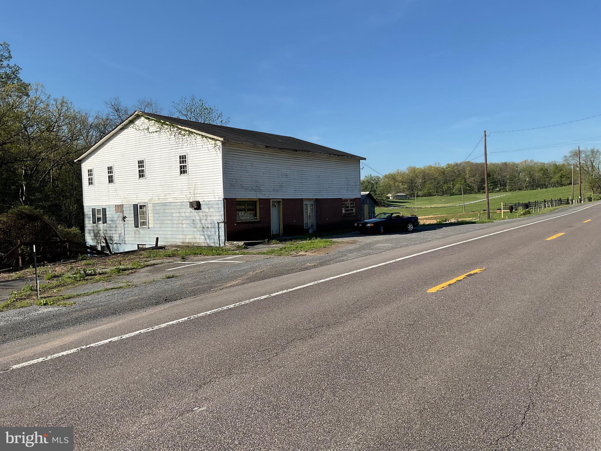 Giant 6000 square foot building in the heart of the charming rural community of Slanesville fronting on RT 29. Needs work, but possibilities are endless. 1/4 mile from Slanesville Store, Post Office, Bank, Automotive shop. Location, location, location! Try to build something half this size for the asking price. Come take a look before someone else beats you to it!