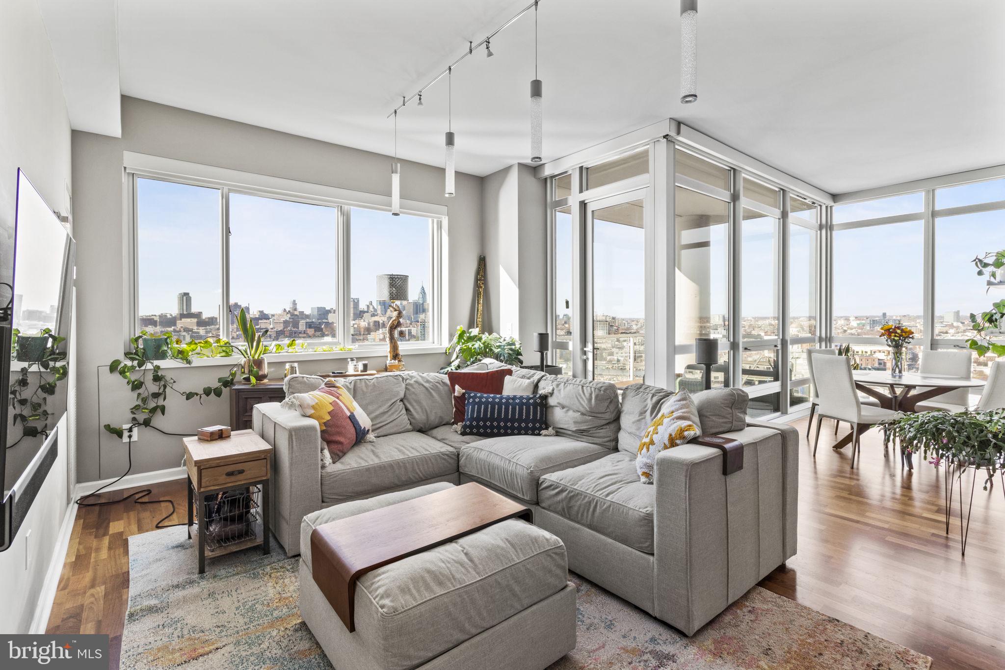 Welcome to this stunning, sun-drenched residence located in the highly desirable Waterfront Square community—Philadelphia’s best-kept secret for luxury living along the Delaware River. This spacious two-bedroom, two and a half bath condo offers breathtaking views of the Delaware River, Ben Franklin Bridge, and the Center City skyline from the 16th floor. The unique floor plan features an open den upon entry and a south-facing living room, dining area, and kitchen with floor-to-ceiling windows, flooding the space with natural light. Step out onto your private balcony and take in the spectacular water, bridge, and city views—perfect for morning coffee or evening relaxation. The updated kitchen boasts granite countertops, stainless steel appliances, and ample cabinetry, ideal for entertaining or everyday living. Additional features include hardwood floors, a custom primary closet, an en suite bath with added storage, custom electronic shades, and a lovely new washer and dryer. TWO parking spaces and a private storage room are included. Waterfront Square is a premier gated community nestled on 9.5 acres, offering 24/7 security, concierge service, lush green space, a dog park, and convenient on-site EV charging stations. Resort-style amenities include a Junior Olympic-size indoor pool, hot tub, sauna, steam room, bi-level fitness center, massage rooms, sundeck with grills and firepits, and magnificent waterfront views. Outdoor enthusiasts will love the Delaware River Trail, perfect for walking, running, or biking, connecting you to Penn’s Landing and Penn Treaty Park. A complimentary resident shuttle provides round-trip service to Center City and 30th Street Station. Just steps to Sprouts Organic Market, and walking distance to Northern Liberties, Old City, Race Street Pier, and vibrant waterfront dining and entertainment. Enjoy easy access to major routes, the stadiums, and Philadelphia International Airport. Waterfront Square offers the ultimate blend of privacy, security, and convenience—perfect for those seeking a peaceful retreat with access to the best of city living. Experience waterfront luxury at its finest—schedule your private tour today!