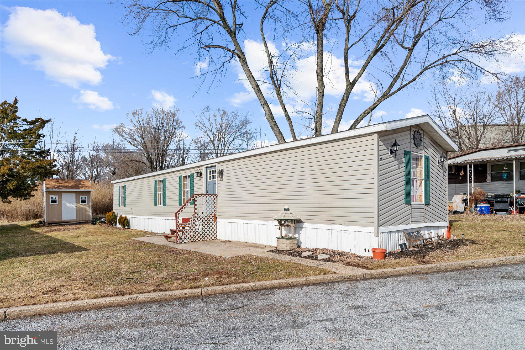 Cute mobile home with three bedrooms, one bath in a peaceful country community with quick access to 422.  Laminate flooring carries through the living room and kitchen, kitchen has gas range and corner built-in cabinet. Convenient laundry area with outside access. Carpet in all three bedrooms.  Walk-in closet was once a second bathroom and still has the now capped plumbing under the flooring.  Shed in back for additional storage space.  This home is immediately available for its next owner!