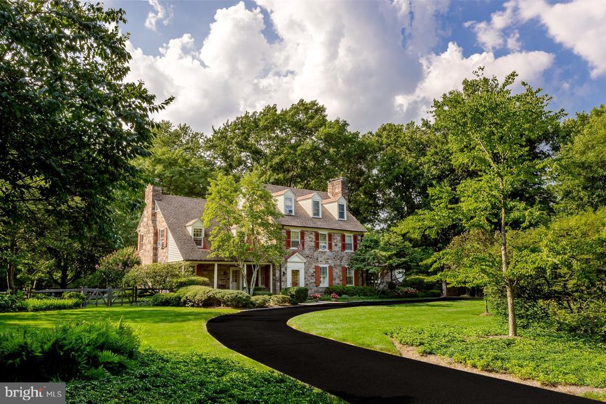 Beautiful 1925 stone Colonial manor farmhouse with a large circular driveway that sits on 1.7 acres is ready for new stewards. This 6 bedroom 5.1 bath home with a detached 2-car garage has been meticulously maintained and cared for.  Offering a private bucolic park-like setting with beautiful specimen trees and plantings and an amazing outdoor entertaining space and inground pool. This lovely manor home is from a bygone era with old world charm with today's modern amenities.Enter into the gracious center hall with a formal living room to the left with a brick wood burning fireplace flanked by original shelving and wood moldings with gorgeous original wide plank floors, formal dining room is to the right which also offers a beautiful brick wood burning fireplace perfect for entertaining on winter nights! Beautiful original built in glass faced china cabinets in 2 corners add to the charm of this spacious dining room. There is a lovely library/sitting room with built-in walnut shelves and corner china cabinet.  Brand new large kitchen with adjoining spacious family room just added to the house! Country French designed chef's gourmet kitchen with top of the line appliances offering Soapstone and Butcher Block countertops, gorgeous French styled tiled backsplash, farmhouse sink and wood style tile flooring. This amazing kitchen has plenty of storage and pantry space for all of your cooking and baking needs, you will find a powder room with a small mudroom off this kitchen space.The new family room has a 3rd stone gas fireplace flanked by built-ins with 2 walls of windows and French doors that lead to the stunning outdoor covered patio. Upstairs on the 2nd floor you will find 4 bedrooms and 4 baths. The first bedroom is light filled and spacious with an ensuite bath with heated floors and claw foot tub. A beautiful white brick fireplace is also in this bedroom that has gorgeous views of the outside. The second bedroom is also light filled and spacious with an ensuite marble floor and shower. The master bedroom is spacious and light filled with a  vaulted ceiling and a beautiful new gorgeous ensuite bathroom that will give you the spa-like experience we all look for, a large soaking tub and oversized shower and heated floors.The 3rd floor offers another bedroom and full bath with a comfy sitting room. You will also find 2 office spaces on the 2nd floor..perfect for working at home!The outdoor space is just gorgeous! Beautiful plantings, Pennsylvania blue slate covered patio, fantastic outdoor fireplace, inground pool... your own private oasis that you will never want to leave, this is truly an entertainers dream house!This property is centrally located  to fabulous shopping, restaurants, 309, the turnpike.Don't miss your opportunity to be the new stewards of this wonderful home!