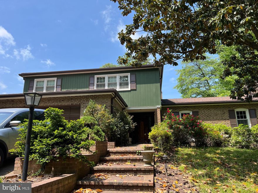 Welcome to the  opportunity in the highly coveted Chain Bridge Forest neighborhood. Presenting a 5-bedroom, 3.5-bathroom residence that exudes timeless elegance and promises a life of comfort and sophistication.

From the moment you approach the property, the stunning curb appeal greets you with a landscaped yard adorned by a mature Japanese Maple, setting the tone for the beauty that awaits within. Step through the elegant entryway. 

The main level a gracious layout, featuring a stately library that beckons with its warm ambiance, a formal dining room perfect for hosting intimate gatherings, and a sunroom that bathes in natural light, providing a serene space to unwind and relax. The classic hardwood flooring throughout the home.

While the price reflects the potential for new kitchen appliances, the light-filled kitchen itself is a canvas of culinary possibilities. Enhanced by skylights that infuse the space with radiant sunshine, it offers a perfect blend of functionality and charm.

The upper level has double closets in all bedrooms, ensuring ample storage for all your needs. The expansive primary suite is a true retreat, providing a sanctuary of comfort with its generous proportions and well-appointed ensuite bathroom.

The spacious basement unveils a sprawling family room, a full bedroom, and bathroom, all seamlessly connecting to the captivating backyard oasis.

The two car garage has a bump-out to be transformed into a full bathroom, adding even more convenience and value to the home. 

Stepping outside, you'll be captivated by the beautiful backyard retreat that awaits. Complete with a veranda that offers shade and comfort, a refreshing pool to cool off on warm summer days, and a convenient shower for after-swim refreshment, this outdoor haven is tailor-made for both relaxation and entertaining.

10 minutes from the  DC School system, and convenient to Regan National & Dulles. 
Relax & Resync after your work day, with a resort lifestyle spring-fall. You'll find the Pimmit run trail connects to the neighborhood, and the C&O canal is only 5 minutes away; walk or bike to Georgetown, or kayak the canal. Nature abounds with trails to the Potomac river and nature center. 
In summary, this listing is more than just a home; it's a lifestyle of unparalleled elegance and comfort. With its spacious interiors, charming features, and enchanting outdoor spaces, this property presents a rare opportunity to own a piece of Chain Bridge Forest's finest. Don't miss the chance to make this dream residence yours today. Contact us for a private showing and envision the life that awaits you in this exceptional home.