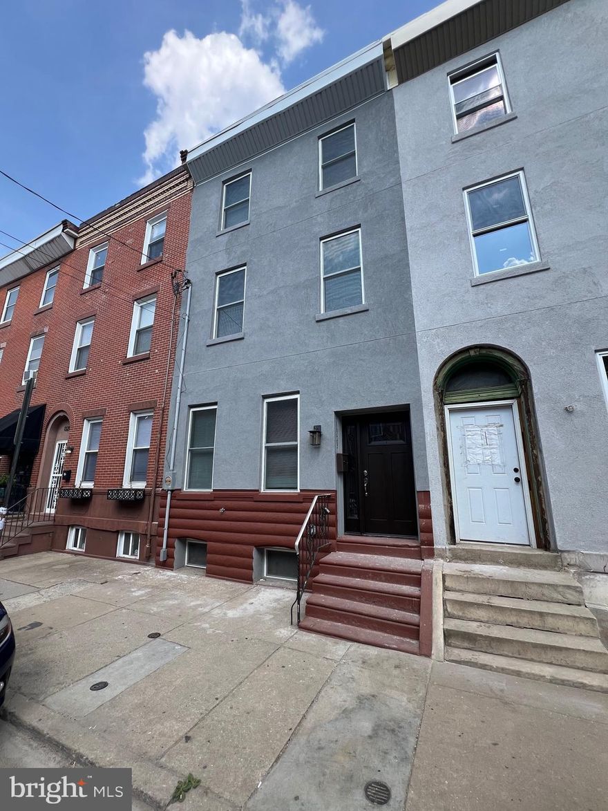 Welcome to this rare find: a 7-bedroom, 5-bath city mansion with impressive modern features. The finishes leave nothing to be desired, and you'll want to make this YOUR home right away! The open floor layout boasts 10 ft. ceilings, professionally painted walls, Pergo floors, recessed lighting, and modern bathrooms with beautiful tile work. The stunning kitchen features plenty of cabinets with stylish inspiration, soft-closing drawers, and modern amenities such as granite countertops, stainless steel appliances, an over-the-range microwave, and a beautiful backsplash. The first floor includes a bedroom and a full bathroom for convenience and access to a huge backyard, perfect for summer grilling. The second floor includes 3 bedrooms, including a master bedroom with an en-suite bathroom, closet spaces, and a balcony off the bedroom. The third floor offers 3 additional bedrooms plus a den, another master bedroom with an en-suite bathroom, a laundry room, and a balcony off the bedroom. The lower level is large and perfect for storage space. Other important features include a 2-zoned new central air and heating system, a new water heater, a new roof, new doors and windows, and much more. Conveniently located near popular restaurants and local shops, including Target, Sprouts Farmers Market, and Wine & Spirits, all less than a ten-minute walk, as well as the vibrant Passyunk Square.