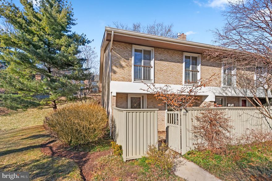 Bright and beautiful 3 Bedroom, 2.5 bath end of group townhome in prime location.  Large family room/kitchen with gas fireplace,  granite counters, custom cherry cabinets.  The kitchen opens to a front courtyard.  Spacious living room with custom built-in bookshelves. Large sliding glass doors open to a handsome stone sitting wall and rich water feature.  Hardwood floors through out.  Come put on the personal touches and make this your own.  "As is"