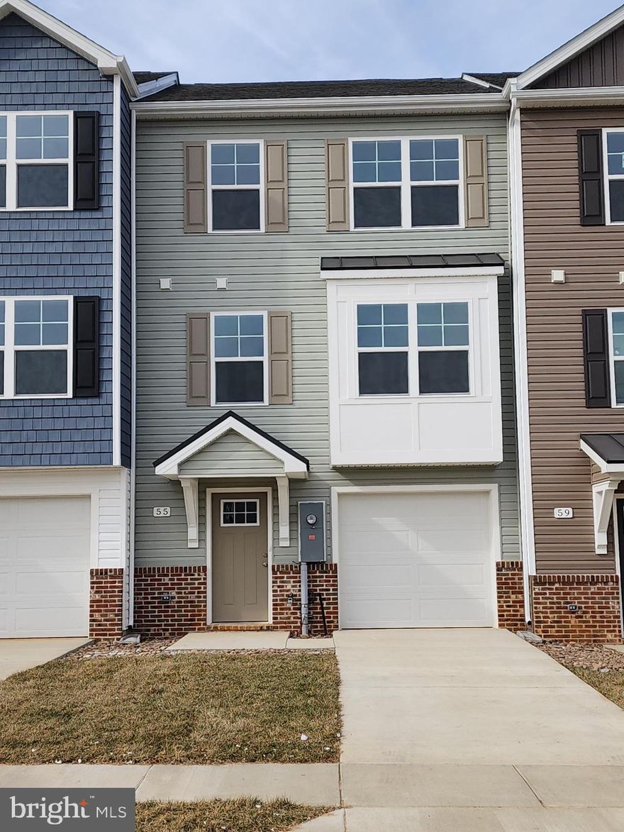 Brand new garage townhome for lease and YOUR FIRST YEAR POWER BILL IS FREE!!! This interior-unit 4 bedroom, 3.5 bath garage townhome has an open concept design on the main floor w/ a kitchen island with granite top, 42" Painted Boulder colored cabinets, a high low peninsula with granite top for entertaining, stainless-steel appliances, a large living room w/ a bump out and a half bath. The upper level features a large primary bedroom w/ cathedral ceiling, walk-in closet, double vanity and a walk-in tile shower; two guest bedrooms, full guest bathroom, linen closet and laundry. The lower levels feature a coat closet, foyer, single car garage w/ automatic garage door opener (app enabled also) and fourth bedroom with a full bath & linen closet and a door to access to your large backyard, this room makes a great recreation room as well. There are NO homes built behind you here, pasture view!!! Throughout the home you will find recessed LED's, ceiling fans in the Primary bedroom & living room w/ each additional bedroom pre-wired for ceiling fans. High/Low outlets w/ pass through plates w/ CAT5/COAX/HDMI in Owner's bedroom & living room to make mounting your TV a breeze.