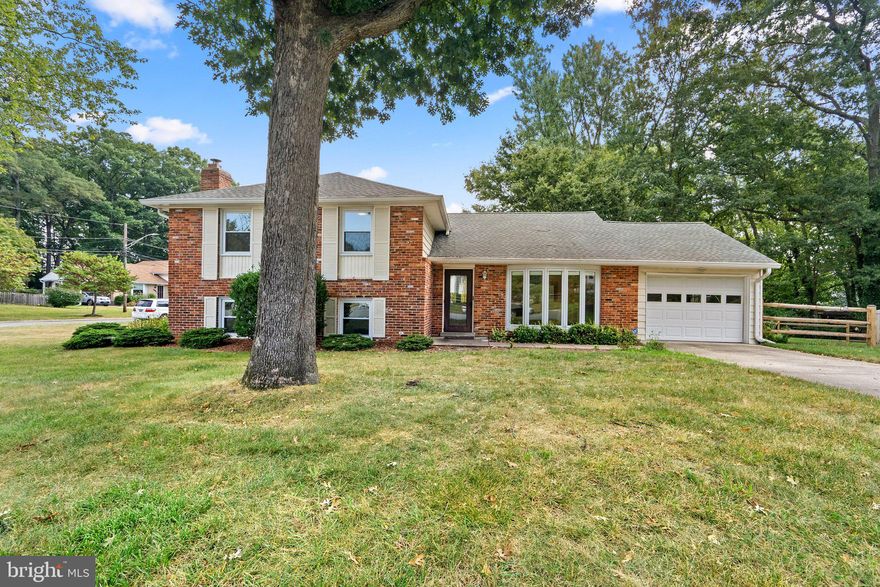 BACK ON MARKET! BUYERS GOT COLD FEET WITHIN 24 HOURS OF CONTRACT ACCEPTANCE! Welcome home! This charming 4-level split foyer boasts an impressive 5 bedrooms and 2.5 baths, making it the perfect haven for your family's comfort and convenience. From the moment you step inside, you'll be greeted by the cozy ceramic tile entryway that sets the tone for the rest of this incredible property.

The main level features gleaming hardwood floors that flow seamlessly throughout, creating a warm and inviting atmosphere. The heart of the home is the kitchen, adorned with rich wood cabinets featuring glass fronts, providing a touch of sophistication. Natural light pours in through the large bay window, illuminating this culinary space, making it an absolute delight for any home chef.

Adjacent to the kitchen, the separate dining area offers a charming ambiance, with French doors leading to an expansive outside deck. Whether you're hosting a family dinner or a summer BBQ, this space is perfect for enjoying meals al fresco or simply soaking in the tranquil surroundings.

The family room is a cozy retreat, complete with its own large bay window that floods the space with natural light. It's the ideal spot for unwinding, entertaining, or simply enjoying quality time with loved ones.

On the upper level, you'll discover four generously sized bedrooms and a well-appointed bath. The primary bedroom stands out with its ensuite bathroom, providing privacy and convenience.

The first lower level is a fantastic surprise, featuring a spacious room with a charming fireplace, an additional bedroom, and a convenient half bath. This area is perfect for creating a cozy entertainment space or even a guest suite. The laundry area completes this level, ensuring your daily chores are a breeze.

Situated on a corner lot, this property offers the bonus of an attached garage, ensuring your vehicles are sheltered from the elements year-round.

Don't miss the opportunity to make this wonderful 4-level split foyer your forever home. With its spacious layout, charming features, and unbeatable location, it's a place where cherished memories are waiting to be made. Come and experience the magic for yourself – schedule your showing today!