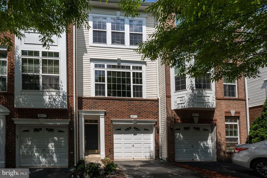 One owner, 3 bedroom, 2.5 bathroom townhouse in the Stonebridge High School District!!  2 Master Bedrooms on upper level with new laminate wood flooring sharing 1 large hallway bathroom.  Main level features a family room, dining room and kitchen with new stainless steel refrigerator and laminate wood floors.   The lower level offers a very rare 3rd bedroom, plus laundry closet.   Ample outdoor space to entertain with a large deck surrounded by a large mature tree for privacy and a brand new patio underneath.  Belmont Country Club amenities include High Speed Internet, Cable TV, Pools, Tennis, Basketball, Volleyball, Playgrounds, Walking Trails & the Historic Belmont Manor. All residents enjoy the use of the country club for dining/entertaining & all social events. Please contact Belmont Country Club Membership directly for a tour of the club and its facilities.