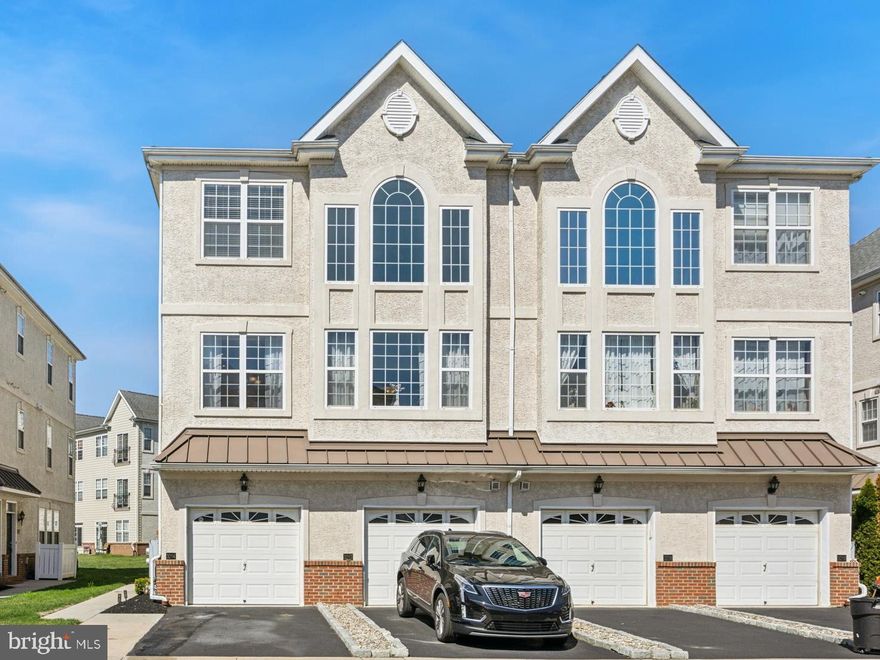 Welcome to The Villas at Packer Park—a quiet, contemporary community offering the perfect blend of city access and suburban tranquility. This beautifully maintained 3-bedroom, 2.5-bath condo, built in 2006 and owned by its original owner, is just a block from scenic FDR Park and minutes from Philadelphia’s sports stadiums. Step inside to find elegant high-end appointments and finishes throughout, custom iron handrails, and a thoughtfully updated interior that exudes comfort and style.

The heart of the home is the open-concept kitchen, featuring sleek quartz countertops, subway tile backsplash, recessed lighting, and convenient counter seating—all flowing effortlessly into the sunlit living area with vaulted ceilings, oversized windows, and custom window treatments. The bright dining room is perfect for gatherings, with rich hardwood flooring that adds warmth and character.

On the third floor, you'll find three spacious bedrooms with outfitted closets, including a serene primary suite complete with a juliette balcony, crown molding, ceiling fan, and a fully renovated en-suite bath featuring individual his & hers showers with dual rain shower heads. An updated full hall bath and a stylish powder room round out the home’s modern upgrades.

Enjoy the ease of a private garage with driveway parking and the peace of mind that comes with a condo fee covering all exterior maintenance, roof care, landscaping, and snow removal. This is a rare suburban retreat nestled in the heart of South Philadelphia—close to everything, yet quietly tucked away.