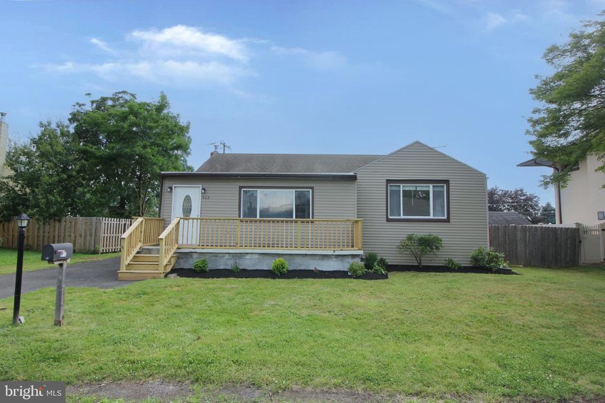 A bright and welcoming home not to be missed. Cute, move-in ready 2 bedroom, 2 bath home features a large enclosed porch or sunroom, arched doorway, and an open floorplan with the living and dining rooms flowing together. Eat-in kitchen has been updated previously with 42" white shaker-style cabinets, vinyl flooring, and electric cooking. The front bedroom has hardwood flooring and two closets. Second bedroom has a ceiling fan, and carpet. Bedrooms share a full bath with a tub shower. Enjoy the outdoors on the covered patio that overlooks the large, private fenced yard. The full unfinished basement provides the laundry area, a full bath with stall shower, plus potential for additional storage and living spaces.  Located within close proximity to shopping with easy access to major highways. All the work has been done! This one is ready to enjoy.