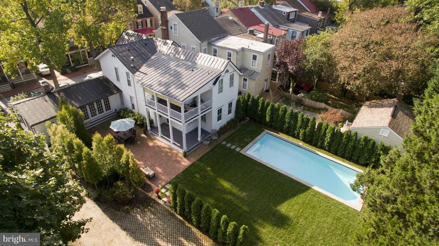 One of the finest homes in all of the Historic District. Sprawling over 3 city lots boasting one of the largest parcels in downtown.  Featuring state of the art custom kitchen, 5+ BR, carriage house & garage.  Private back yard offering a custom built saltwater pool, water feature and English garden providing tranquility in the heart of a vibrant downtown. A home for the most discriminating buyer!