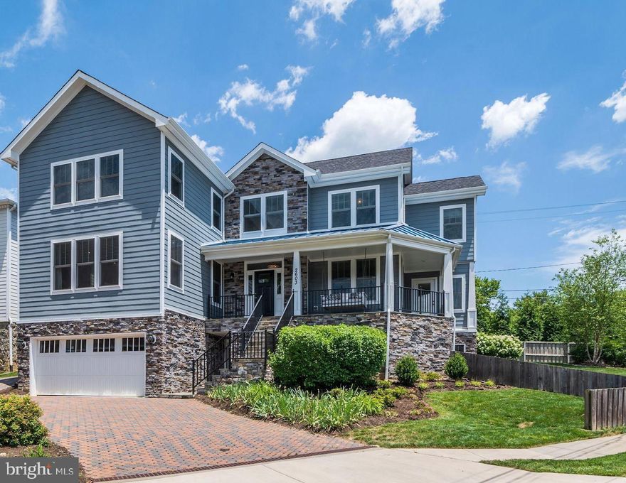 AMAZING NEW PRICE FOR THIS IMMACULATE LYON PARK HOME WITH CONTEMPORARY CRAFTSMAN APPEAL and just minutes from the amenities and entertainment of Clarendon!   Gorgeous Lyon Park Craftsman has been lovingly maintained and updated with Built-ins and Designer Touches. Total of 3 Parking Spaces and Huge Private Professionally Landscaped Lot the includes a Dining Area,  Entertaining Area with Fire Pit and ample Green Space for Play.  Minutes to Orange/Silver Line Metro, Shops, Restaurants and Iconic Neighborhood Gathering Place  Lyon Park.                                                                                                                      Home is wonderfully designed with Open Concept, Light Filled Floor Plan that centers around a crisp gourmet kitchen.  The Main Floor features a Great Room with Custom Fireplace Surround and Built-Ins. The Spacious Kitchen is open to a Breakfast Nook with banquette seating and to the Outdoor Patio and Expansive Lawn. This Level also features a Sun Drenched office/sunroom with separate entrance and French Doors.   Upper Level has Large Owner's Suite with Walk-in Closet, Gas Fireplace, Ensuite and Sitting Area.  Three Additional Bedrooms and Two Baths plus a spacious Laundry are found on this floor. An Oversized Two Car Garage on the Lower Level opens to a spacious Mudroom with Built-In Cubbies and Closet as well as a Second Outside Entrance.  A Recreation Room and adjacent Wet Bar with Beverage Cooler are featured.  The Fifth Bedroom and a Full Bath complete this level.  The property also boasts a rare 3rd dedicated parking space - perfect for guests.  This Home is about Joyful Living, Comfort and Community all of which come together in quintessential Lyon Park style while swinging on a Custom Swing on your Wrap-around Front Porch!!