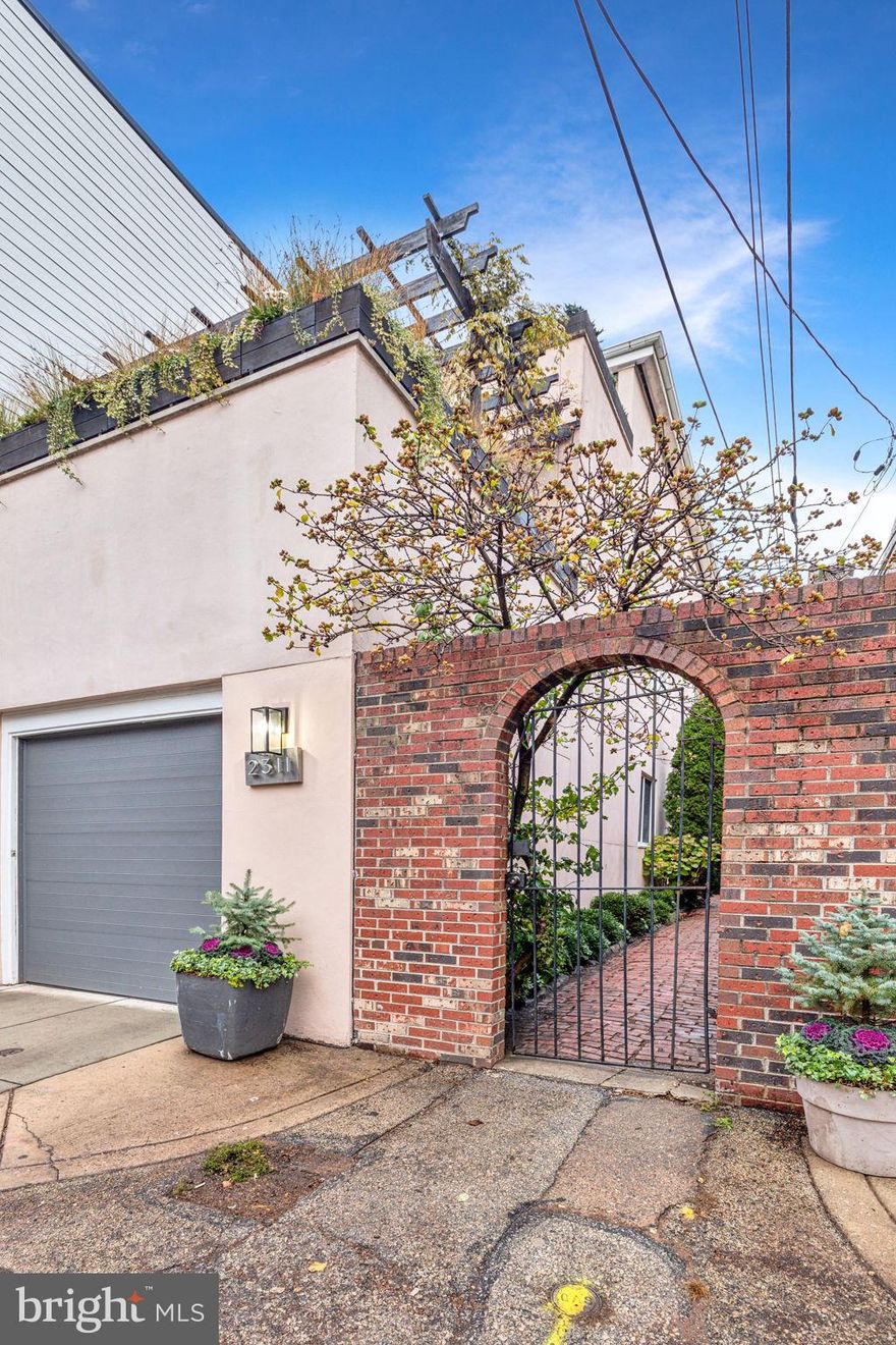 A rare opportunity to own a unicorn home in the heart of Fairmount. This home boasts incredible natural light, has an unbeatable location on a low traffic street, and architectural design that will blow you away. 2311 Perot is a uniquely special house that features 4 bedrooms and 2.5 bathrooms and a 1 car garage. A beautiful gated alleyway off of Pigs Alley greets you as you approach providing a private oasis. You enter the home through a large foyer with soaring ceilings exposed to floor above. The first level has two bedrooms, a full bathroom, lots of storage and access to the garage (which has a brand new garage door). The grand staircase brings you upstairs to the second level with an updated kitchen, spacious dining area, a half bathroom, and a generously sized living room with a fireplace. Off the living room is a terrace which is perfect for gardening, entertaining al-fresco and BBQ nights. This entire floor has wraparound windows providing southern and eastern exposures with no shortage of sunlight. The top floor has two more bedrooms including the primary, which has an en-suite bathroom and two walk-in closets. There is also a bonus built in desk area for additional work space/storage with a massive skylight. The other bedroom on this level connects to another terrace which has breathtaking light/partial skyline views! Located in the Bache-Martin catchment, this home is close to all major Fairmount hot spots, museums, highways, public transit, Schuykill River Trail and so much more. Book your tour to see this one of a kind opportunity.