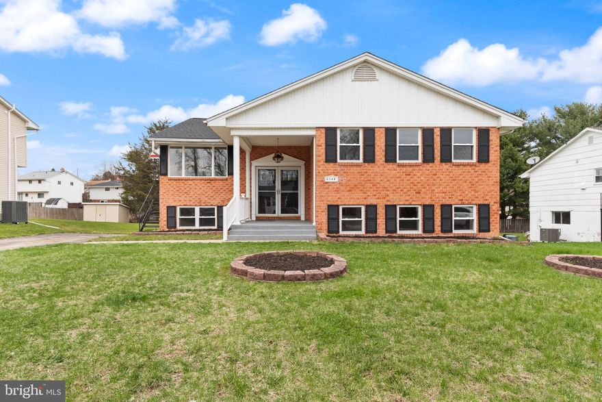 You absolutely don't want to miss out on this meticulously done TRUE 5 bedroom, 3 bath rehab in Randallstown. This home has a brand new roof,  brand new HVAC system, brand new windows, brand new doors,  brand new water heater, brand new kitchen, brand new Luxury Vinyl Flooring throughout, all fresh neutral paint and so much more! This home is better than brand new! The floorplan is AMAZING with a large split foyer and open concept living room, kitchen, breakfast nook, & dining room. The kitchen has quartz counters, stainless appliances, center island and a side door for access to the kitchen for easy grocery delivery.  Off the formal dining room there are sliding doors to a covered deck. The primary bedroom has an ensuite and there are 2 other bedrooms upstairs and a hall bath.  The lower level rec room is huge with stone wood burning fireplace, 2 additional bedrooms and full bath. There are sliders to the rear yard and lots of windows making the lower level bright and spacious!