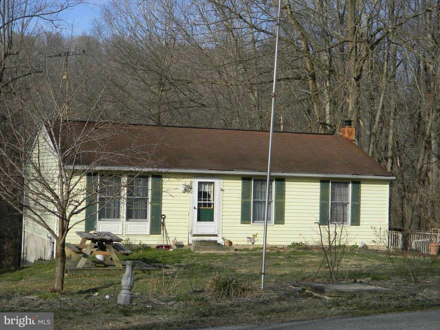 Great potential in this 3 bedroom rancher.  Heat pump is only 4-5 years old, wood stove is included. Property backs to woods and a stream. Property sold as-is.