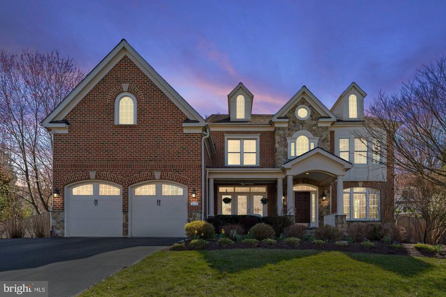 This stunning 6 bedroom, 5.5 bathroom home offers 7,930 square feet with an exceptional blend of luxury, functionality, and privacy. Thoughtfully designed with an open floor plan, the main level seamlessly connects the kitchen to the family room, creating a bright and inviting space for everyday living. Large windows fill the home with natural light throughout the day, while Silhouette window treatments add a touch of elegance. The gourmet chef's kitchen features custom cabinets, new quartz countertops, and backsplash. A mudroom with  washer and dryer helps keep messes contained, while a second refrigerator and oversized pantry allow for bulk shopping and entertaining. On the upper level you will find the primary suite which boasts an impressive his and hers walk-in closet system, providing direct access to both the bedroom and bathroom. Each additional bedroom features high-end custom closets, ensuring ample storage and organization. Upstairs you will also find an additional washer and dryer. The finished 4th floor multipurpose space with en suite bath can be used as an additional bedroom, playroom, au pair suite, or private office. The spacious finished basement offers separate areas for entertaining and exercise, a wet bar, generous finished and unfinished storage space, and a large bedroom with en suite bathroom. Sited on a 0.40 acre lot, this beautifully landscaped front and back yard features over $250,000 worth of improvements, provide privacy and include a high-end grill, a unique gas-to-wood log fire pit, and a relaxing water feature. Outdoor living is further enhanced by a welcoming front porch, an oversized two-car garage with extra storage, and a cul-de-sac location that serves as a great play area. Wolftrap/Kilmer/Madison Pyramid