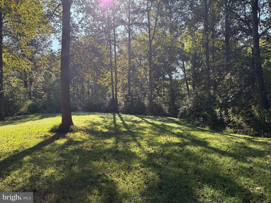 Private house site with a 3 bedroom approved conventional perc.  Ready to build your Dream Home?  The Open area for the house and the septic field is ready. Dark Run Creek backs up to the lot with a sandy area, just relax in the sun and listen to the sounds of the water and/or have a picnic by the water, maybe catch a fish, if not the 15 Acre Lake is available for fishing, bring your John boat or Kayak.  The Subdivision provides a pool, playground and Clubhouse also for you and your guests. HOA fee is $600 annually. Don't miss out on this Beautiful Private lot, a must see!