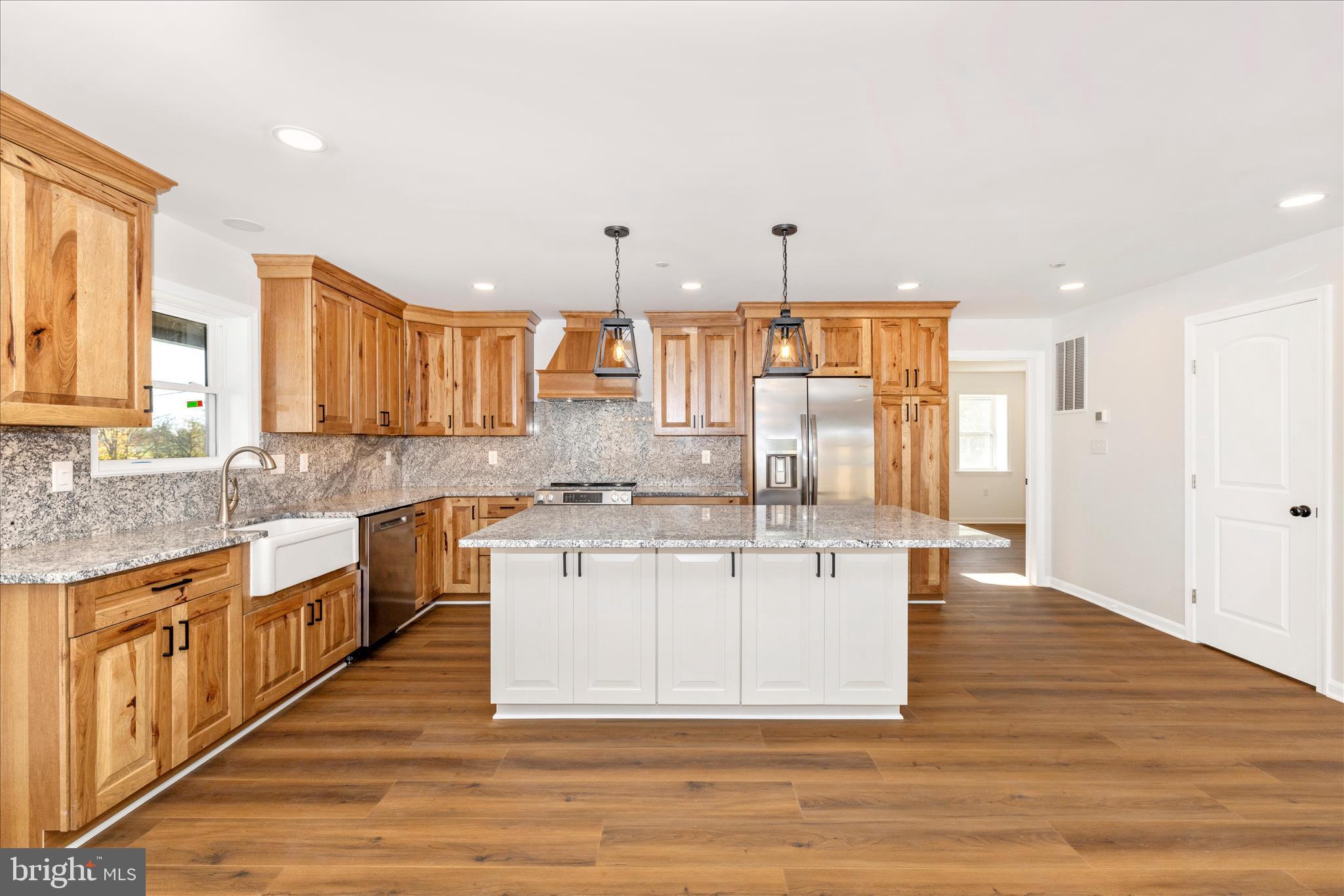 This Adorable Cape Cod residence, built in 1932 and just underwent major renovation in 2025, offers a harmonious blend of classic charm and modern luxury. Nestled on a generous 1-acre lot, the property boasts a level landscape, perfect for outdoor gatherings or serene moments of reflection. Step inside to discover an inviting open floor plan that seamlessly connects the gourmet kitchen, featuring upgraded countertops and a spacious island, to the dining and living areas. The kitchen is equipped with energy-efficient appliances, including a built-in microwave, range, and dishwasher, ensuring both style and functionality. Enjoy leisurely breakfasts in the cozy breakfast area or entertain guests in the family room off the kitchen. The home features three well-appointed bedrooms, including an entry-level bedroom for convenience. The primary bath showcases a luxurious walk-in shower, elevating your daily routine to a spa-like experience. With luxury vinyl plank and ceramic tile flooring throughout, every step feels indulgent. Additional highlights include a poured concrete basement with interior access, providing ample storage or potential for further customization. Parking is a breeze with off-street and driveway options. Available for lease starting November 15, 2025, with flexible terms ranging from 12 to 24 months, this property invites you to embrace an exclusive lifestyle in a beautifully renovated home. Experience the perfect blend of comfort and elegance in this remarkable residence.