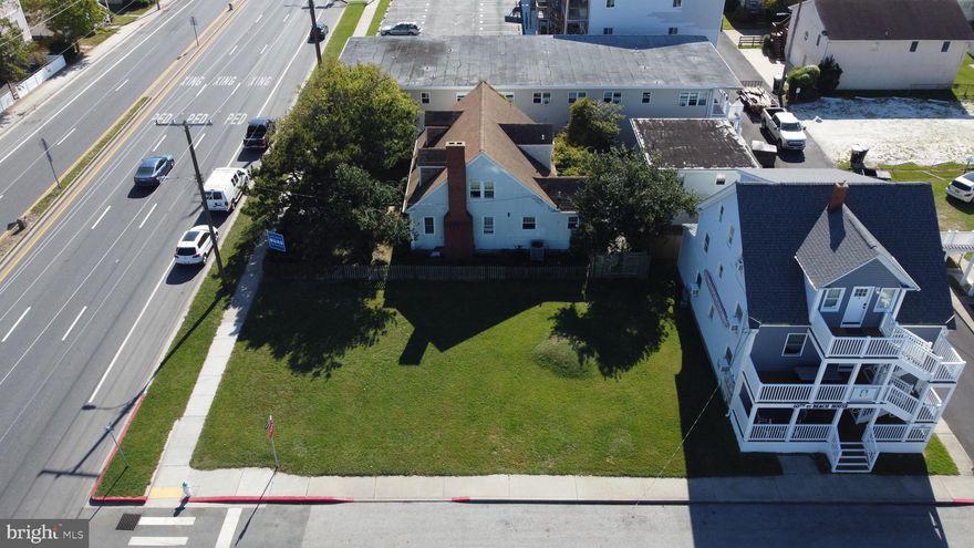 Two Parcels For Sale Updated Multi-Unit Property + Rare Lot Development Opportunity in Downtown OC. Located just two blocks from the beach, boardwalk, and the heart of Ocean City’s entertainment district, 205 10th Street and its adjacent buildable lot offer a unique combination of immediate rental income and long-term development potential. The fully updated 2,744 sq. ft. building includes four move-in-ready units: two spacious three-bedroom, two-bath units, a large one-bedroom, one-bath unit with a full kitchen and living area, and a rear efficiency unit with a private entrance. Each unit has its own porch and is furnished with updated appliances and stylish, coastal-inspired décor, providing a relaxed and inviting experience for guests or tenants. Update 1/21/26: New Kitchen being installed in Unit 5. 

The building has undergone significant renovations, including a full new front façade with three levels of decks, new vinyl rails and steps, a new roof, and interior upgrades throughout. A shared, coin-operated laundry facility on-site offers added convenience and generates additional revenue. What truly sets this property apart is the inclusion of one of the last remaining buildable lots in downtown Ocean City—offering a rare chance to expand with additional rental units or custom development. Whether you’re an investor seeking reliable cash flow or a developer looking to build in one of the East Coast’s most visited beach towns, this package delivers both present-day performance and future upside in a walkable, high-demand location.