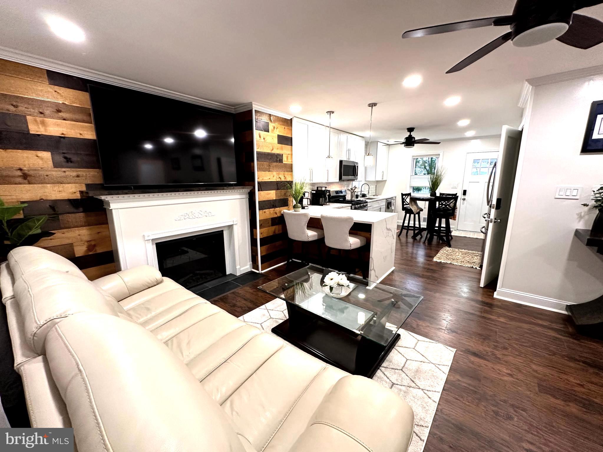Do not be fooled by the exterior size of this incredible fully renovated single family with three levels of living space! This house features TWO HOMES INSIDE OF ONE and has two fully independent living spaces with their own appliances! The savvy owner will recognize this gem instantly and continue to generate income OR share the space with extended family.
Unit ONE has three large bedrooms with newer windows, engineered floors and fresh paint while Unit TWO has two nice sized bedrooms, beautiful tile, top of the line appliances and an exquisite bathroom.
When you enter the Unit One, you will visit two levels of beautiful engineered woof floors, fresh paint, new windows, a dream chef's kitchen that features a waterfall quartz countertop, stainless steel appliances and modern white cabinets with large handles. This unit also features a real wood fireplace, two modern bathrooms , each have granite countertops and large vanities. As a bonus, the main bedroom has its own ensuite bathroom which features a double sink vanity for more storage space. The extra large loft bedroom currently hosts two full size bedroom and a closet in a roommate style design. This unit can host up to 8 adult comfortably and is the unit that generates income.
Unit Two, locate in the basement features it's own chef's kitchen, two bedrooms and one modern bathroom. The exquisite design of the owner continues in this space with the same golden accent, high end appliances, modern flooring, decoration and style. The two bedroom on this level feature nice size closets and ample storage space and cabinets. In the backyard, you will find a large painted deck, an additional storage room and a semi-fenced backyard. This house sits on a very large lot and is located minutes from Lakelands, Kentlands, 370 and River Rd to name a few.
The ingenious setup of this house allows you to keep one of the units as an income generating investment while you live in the other one OR use both units for you and your extended family. You will not be disappointed. Rental income will be provided upon request.