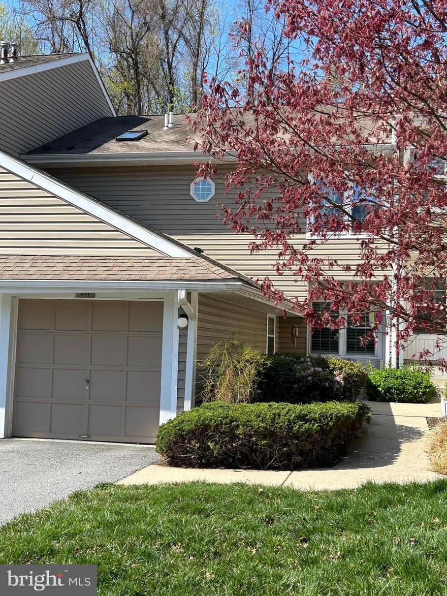 Welcome home to the community of Darlington Woods! Why not make 211 Nottingham Ct your new address?! 
211 Nottingham Ct is a 2 story condo, not a flat like some of the other units you will find here. It is a 2 bedroom, 3 bath unit with an attached one car garage with inside access. It is located in the desirable borough of Chester Heights. Facing north east, this unit receives sunlight in the front in the morning and sunlight in the back in the afternoon. Some recent updates include some fresh paint, tile flooring, newer carpets, and newer microwave and stove. Bathrooms have mostly been updated by replacing plumbing fixtures.
One of the first things to notice, once inside, is the entry foyer/entry hall with the beautifully tile floor. This foyer/hallway connects this floor efficiently together. Connecting the powder room, laundry room, living room, kitchen, and breakfast room aright at the top of the hall. The dinning room is connected to the living room & kitchen on the opposite end of the home. The living room is accented by a fireplace as centerpiece and features two large windows with plantation shutters. The living has easy access to all rooms as it should.
The kitchen is flanked by the dining room on one end and the breakfast room on the other. The breakfast is open to the kitchen and is only separated by a half wall. The breakfast room features 2 large windows with plantation shutters  
The dining room features a sliding glass door to the rear deck patio. The view from the back is a terraced hill with trees beyond it. You can not see a neighboring property which will leave you with sense of privacy and green views 3 out of the four seasons. 
Conveniently the living room, kitchen and foyer converge at the stairs leading up to the bedrooms. At the top of the stairs there is a small open space for a somewhat large decorative plant or even a bed for a furry friend if you bring one along. 
This second floor consists of 2 bedrooms and 2 full baths. The large main bedroom features a private bath with double vanity, large soaking tub and a walk-in shower. The shower features a beautiful frameless glass door. There is also a walk-in closet. A second bedroom and a full hall bath complete this floor. 
The Darlington Woods community includes a clubhouse, gym, tennis courts, and pool! It is very quiet here. The location is tremendous. Darlington Woods is about 2 miles to Septa's Regional Rail line (Wawa Station). Less than five miles in either direction you will find Riddle Hospital, Wollfes Apple House (locally grown & produced products), The Glen Mills golf course, the Glen Mills School, The Promenade at Granite Run, Costco, Brinton Lake Shops, Newlin Grist Mill, the public library and schools and so much more. 
An extra added bonus for nature buffs, depending on the time of year, you will see the occasional white tail deer or red fox out back. Make your appointment today!
