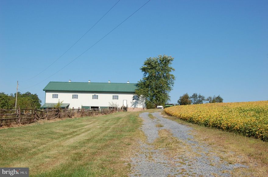 LAND WITH BARN ONLY, no house. Quiet, country location. Barn built in 2003. The barn is steel structure that measures 42x100,clear span. With 4 acres of woods, with creek. Annual Clean and Green taxes are $2,061.32. Features  55.81 acres with stocked fish pond. 45 acres cropland tillable. Chicken houses are okay.