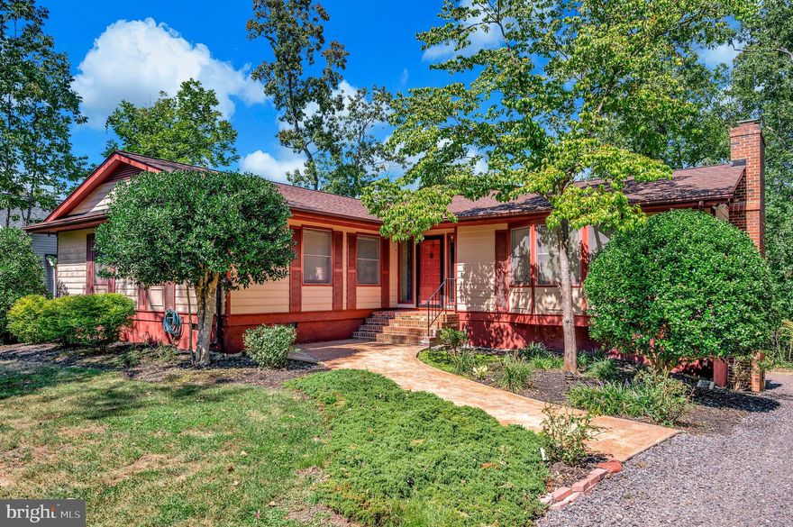 Welcome to this 3-bedroom, 2.5-bath home boasting approximately 2600 square feet of finished square footage that’s ready for your personal touch! With great bones and a welcoming layout, it’s the perfect opportunity to create your dream space.
From the moment you arrive, you’ll be greeted by a stamped concrete walkway leading to the inviting front porch. Inside, a spacious foyer provides the perfect spot to welcome guests. To the right, the expansive living room makes a stunning impression with its vaulted beam ceilings, gleaming hardwood floors, a floor-to-ceiling brick fireplace for cozy evenings, and an abundance of natural light. A door leads directly to the back deck, seamlessly blending indoor and outdoor living.
The sizable kitchen offers plenty of counter space and storage, while the formal dining room is open, bright, and ideal for gatherings. Down the hall, you will find the primary suite with an ensuite bath, two additional bedrooms, and a guest bath.
The lower level expands the living space with a bright, open rec room featuring windows and walk-out access, a convenient half bath, and a laundry room. Entry from the two-car garage ensures functionality for everyday living.
At the rear of the home, the expansive deck spans much of the home, overlooking the yard and providing the perfect space for entertaining, relaxing, or enjoying the outdoors.
This home is ready for its next owners to bring their vision and make it shine!

Nestled in a private, secure, gated community, Lake of the Woods is a paradise of possibilities. With two lakes, a golf course, an equestrian center, fire and rescue services, and even a church within its bounds, this community offers a diverse range of activities. From boating, water skiing, kayaking, and golfing to the simple joy of soaking in mesmerizing views from the clubhouse, deck, yard, or beaches, there's something for everyone. Engage your interests by joining over 60 clubs and organizations, or perhaps indulge in a game of bridge or contribute your talents as a volunteer. Lake of the Woods truly caters to your lifestyle.

Located in Orange County, enjoy the added advantage of low real estate taxes. With home prices spanning from $300,000+ to over $2,000,000, Lake of the Woods is the ideal haven for both full-time residents and weekenders. Don't just take my word for it – come and see for yourself! Allow me to guide you through a tour of Lake of the Woods, showcasing the very essence of what makes this community so special. Experience firsthand the captivating charm of Lake of the Woods!