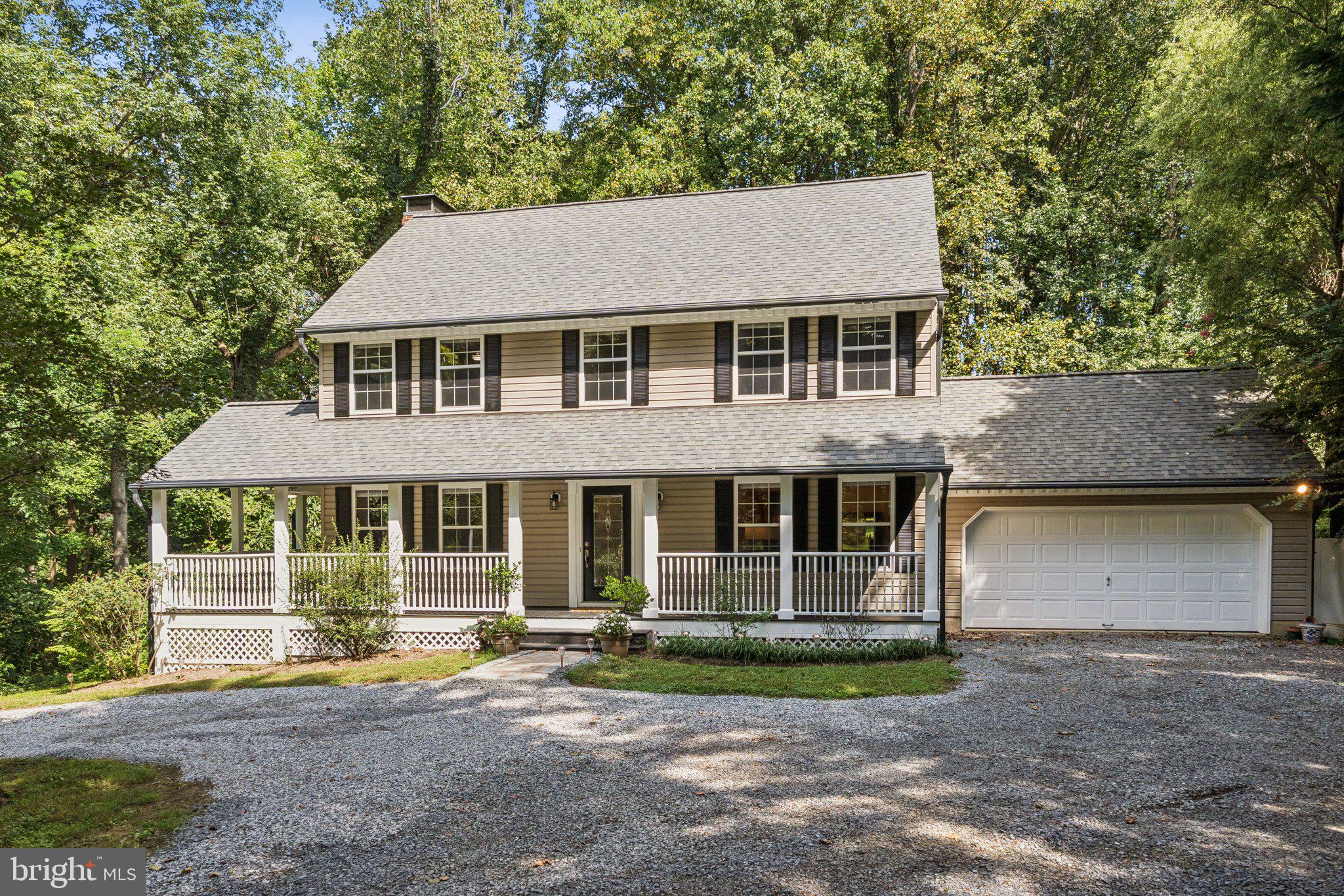 Nestled at the end of a private lane, this modern farmhouse-style home offers the perfect blend of charm, privacy, and thoughtful updates. Surrounded by two wooded acres, the setting feels like a retreat while still being convenient to everything you need. A circular drive provides plenty of parking, and a welcoming wraparound porch with multiple seating areas invites you to take in the peaceful forest views.
Inside, the home is designed for both everyday comfort and memorable gatherings. The wood-burning fireplace anchors the expansive living room, which flows seamlessly into the kitchen, while a cozy den/office with custom craftsman-style wood cabinetry offers the perfect spot to unwind. A formal dining room, large enough to host holiday meals, adds to the home’s versatility. The updated kitchen is a standout, featuring elegant wood cabinetry, quartz countertops, bar seating, stainless steel appliances, and ample pantry space. Just off the kitchen, a back deck creates the ideal space for grilling, dining, and entertaining. Upstairs, you’ll find a spacious primary suite with a remodeled bathroom (2025), double vanity, and a large walk-in closet. The updated guest bath and three additional bedrooms complete the upper level. The walkout basement offers the opportunity to expand your living space with sliding doors to the outdoors, a cozy wood stove already in place and flexible unfinished space that could serve as a recreation room, media room, or guest suite down the line.
Outdoors, the property is truly a private oasis. A fully fenced backyard features an in-ground pool with sun deck, a firepit for cool evenings, and natural landscaping that blends seamlessly with the surrounding forest. Whether you’re swimming, entertaining, playing with pets, or simply relaxing, the outdoor spaces are designed to be enjoyed year-round. Watch hummingbirds, osprey and the occasional bald eagle from your own yard. Recent updates reflect the care that has gone into this home, including a new roof (2022), gutter system (2023), fresh interior paint, beautifully refinished hardwood floors throughout the first floor. A two-car garage and additional shed provide plenty of storage and hobbies.
With its combination of privacy and modern updates, this home is truly move-in ready. Conveniently located just minutes from picturesque Chesapeake Beach, 30 minutes from Annapolis, and 45-60 minutes to Washington, DC. Schedule your private showing today.