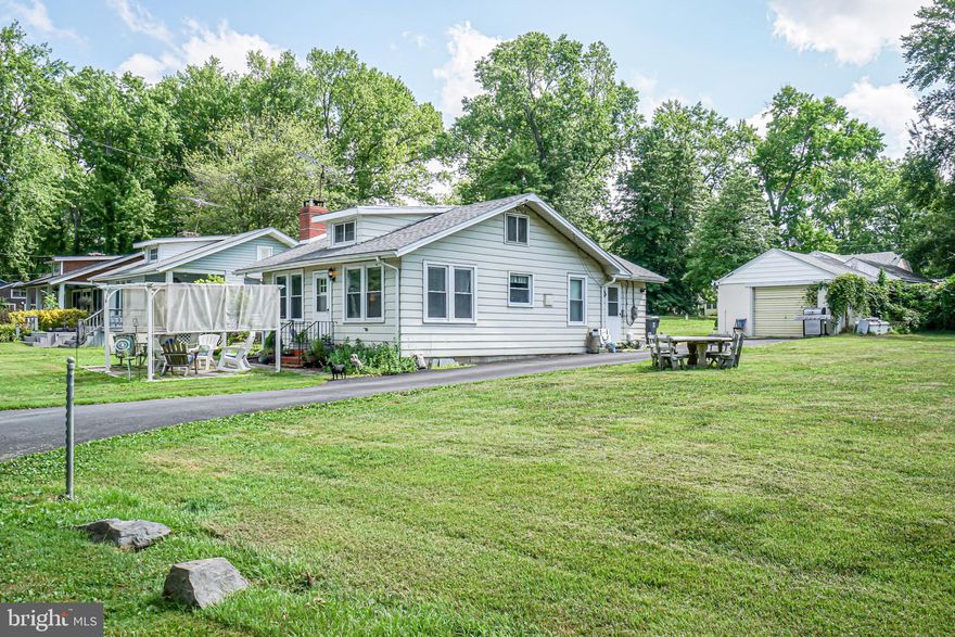 Price Adjustment!! This beautiful cottage by the river offering breathtaking water views is now available for purchase again! The house features two cozy bedrooms, a fully equipped bathroom, and a recently updated kitchen with ceramic tiled floors throughout. In addition, the roof, central air, windows, kitchen cabinets, appliances, granite countertops, water conditioner, garage roof, gutters, and blacktop driveway have all been recently replaced. The price also includes an additional lot next door. Don't miss out on the opportunity to see this wonderful riverhouse! Schedule your appointment today.