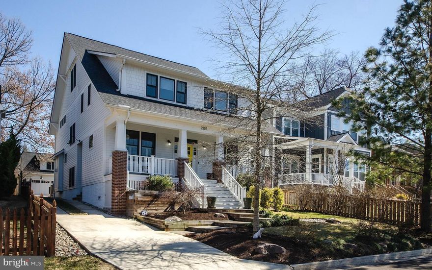 This Home Checks All the Boxes—and Then Some!  This stunning 5,400+ sq ft, four level Arts and Crafts inspired home effortlessly blends modern luxury with timeless charm. With 7 bedrooms and 6.5 baths, it also includes a separate outbuilding with a two-car garage and with a light-filled upper level studio/in-law suite with a 6th bath. Set on a large, fenced 10,658 sq ft lot in Arlington’s desirable Over Lee Knolls, it’s just a mile from Westover Village and the EFC Metro. Relax on the iced tea sippin' front porch, with its cheerful bright yellow front door welcoming you inside. Period details, like mission-style trim, glass breakfront knee walls and custom built-ins create a warm, inviting atmosphere. The spacious dining room connects to a butler’s pantry, and the chef’s kitchen features a large island, high-end appliances, and a spacious breakfast/casual dining area. The family room boasts a coffered ceiling and fireplace, and the screened porch opens to a large Trex deck perfect for unwinding. Upstairs, the primary suite is a true retreat with dual walk-in closets and a marble-trimmed spa bath. The secondary bedrooms are generously sized, with walk-in closets and built-ins. The top-floor suite serves as a fantastic lounge or gaming room. The fully finished lower level includes a gym,  7th bedroom, full bath, and recreation room with built-in wet bar.  The garage offers bike space, a workshop, and additional storage, while the loft above can function as an au pair/in-law suite or office, complete with a service pantry and full bath. An additional driveway behind the garage provides easy access to 23rd St as well. Don't miss the handy generator as well.  This home offers expansive space, top-notch finishes, and a prime North Arlington location—truly a showstopper!