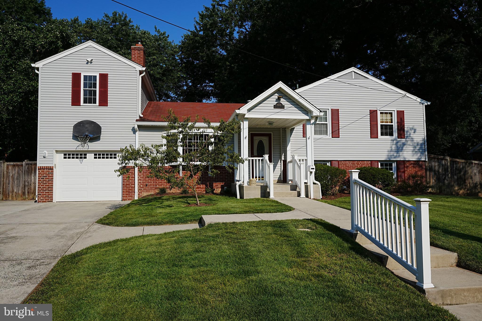 Seller has an assumable 2.25% VA loan on the balance of their mortgage! Waynewood is one of the most desired neighborhoods along the Fort Hunt corridor, nestled between Fort Hunt Road and the George Washington Parkway in the Fairfax County section of Alexandria (22308). 8408 Conover Place is centrally located within walking distance of both the prized Waynewood ES (1 block away) and Carl Sandburg MS (4 blocks away). 8408 Conover is the popular split-level Saratoga model that has been lovingly updated and expanded. It has 5 bedrooms and 2 full bathrooms, but what separates this house from other Saratoga floor plans is the TWO STORY GARAGE ADDITION! Between the two stories, this garage offers 936 square feet of storage space. The garage itself is 28' X 12' to the inside stairs. From the stairs to the backdoor there is still another 13' X 8.5' of space with built-in shelves. The upper level of the garage is 37' X12' offering 444 sq. ft. of storage space. The upper garage level has windows, a skylight, and overhead lighting. The main level of this house is accessed by the front door and by the door from the garage. The main level is open and airy. It features a front living room with bay window, wood burning fireplace and newly refinished hardwood floors. From the front door and living room, the open concept permits you to view the dining area off the kitchen and the back den with a wood stove. The gleaming kitchen features granite countertops, stainless steel appliances and under cabinet lighting. A kitchen island offers space for stools, but there is also a dining area adjacent to the kitchen between the front living room and back den. The back den features two skylights in addition to the windows, recessed lighting and ceiling fan. There is also a convenient pass through counter between the kitchen and back den. A corner wood stove in the back den heats the entire home during the winter. The house also has central A/C and natural gas for heating (as another heating option). Stairs just off the living and dining area lead to the upper and lower levels with quick and easy access to bathrooms. There are 3 bedrooms on the upper level and a full bathroom. The 13' X 11.5' Master bedroom has direct door access into the upper bathroom. The renovated bathroom features recessed lighting and tub to ceiling tiling. There is also a spacious pull-out bathroom storage drawer above the toilet. The two other bedrooms on the upper level measure 11' X 10' and 10' X 10' and all upper level bedrooms have newly refinished hardwood floors. The lower level is accessed by stairs near the front entry. The lower level has another full updated bathroom, two bedrooms and the laundry room. The lower level bathroom has a glassed in shower stall and decorative tiling. The lower level front 4th bedroom is 13' X 8.5' with a cedar lined closet with hidden access to the electrical panel box. The back corner 5th bedroom is 13' X 13' and has door access to the backyard via covered stairs. The laundry room is 10' X 5.5' and the laundry room also offers access to the heat and A/C and the 50 gal water heater. The backyard is level and fully fenced. There is a shed and children's play fort. Along the left side and back fence are racks for firewood and two existing racks with seasoned firewood. There are two gates to access the backyard from the front. The right side gate is double wide and the wider of the two. The driveway, walkways and stairs are all concrete. The driveway will fit four cars. The front entry is covered and offers 10' X 8' of space. This house has easy access to Fort Hunt Road and the George Washington Parkway. Shopping, restaurants and major roadways are minutes away. George Washington's Mount Vernon is less that 10 minutes away. Fort Belvoir, Old Town Alexandria and Washington DC are close by. Great location, awesome house! Don't miss this opportunity!