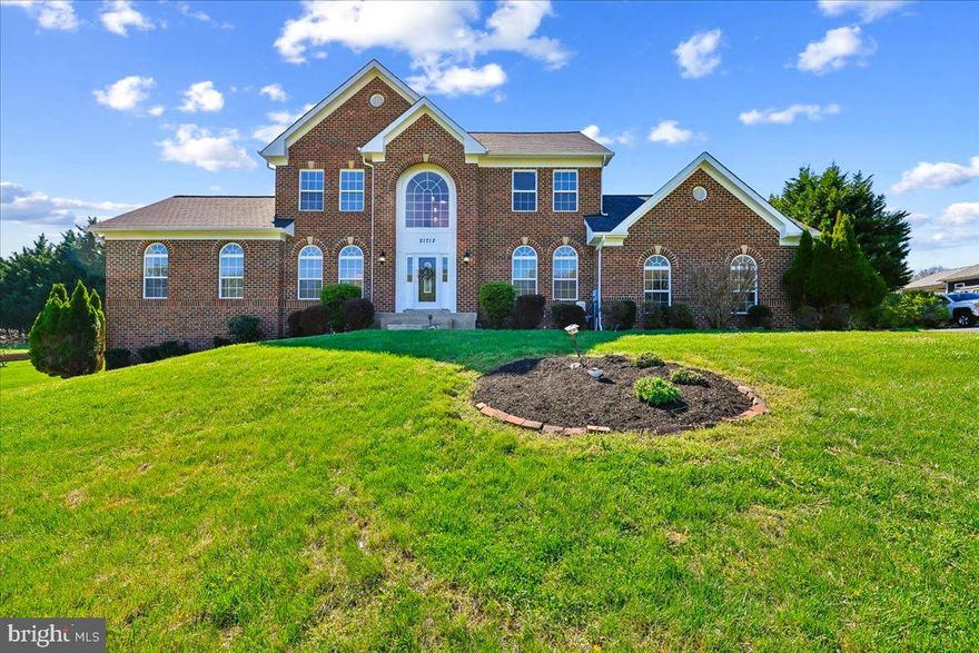 Welcome to your private paradise in Boyds ,  4-sided Custom Built Brick colonial perfectly situated on 1.32  acres of serene & beautiful flat lot. This home has  Designed for entertaining and a large family .The heart of the home is a large  gourmet kitchen, featuring  stainless steel appliances, mosaic back splash, gorgeous quartz countertops, and a  center island adjacent to your  sun-filled breakfast nook  provides the perfect spot for casual meals, while the adjacent spacious family room impresses with  a charming brick fireplace. This Home offers the buyer gleaming hardwood on all levels of the home. The main level also offers a formal dining room, a spacious living room, and a private office and 1st floor master bedroom/in-law suite....along with fresh paint, vaulted ceilings, and freshly sanded wood floors throughout the 2- upper levels. Upstairs, the primary suite is a true retreat, a walk-in closet, and an ensuite bath featuring a double vanity, soaking tub with a view, and stall shower. Three additional bedrooms and a  full  bath complete the upper level— The walkout lower level offers fantastic space made with a 6th bedroom  Plus your own private exercise room along with a full bath, 2nd kitchen and specular recreational room waiting your pool table,  All this with easy access to the front & back yard.  In addition you will have plenty of space on an over size 2-car garage. Enjoy the peace and privacy of this spectacular setting while still being conveniently located near commuter routes, parks, and shopping. This is more than a home—it’s a lifestyle.