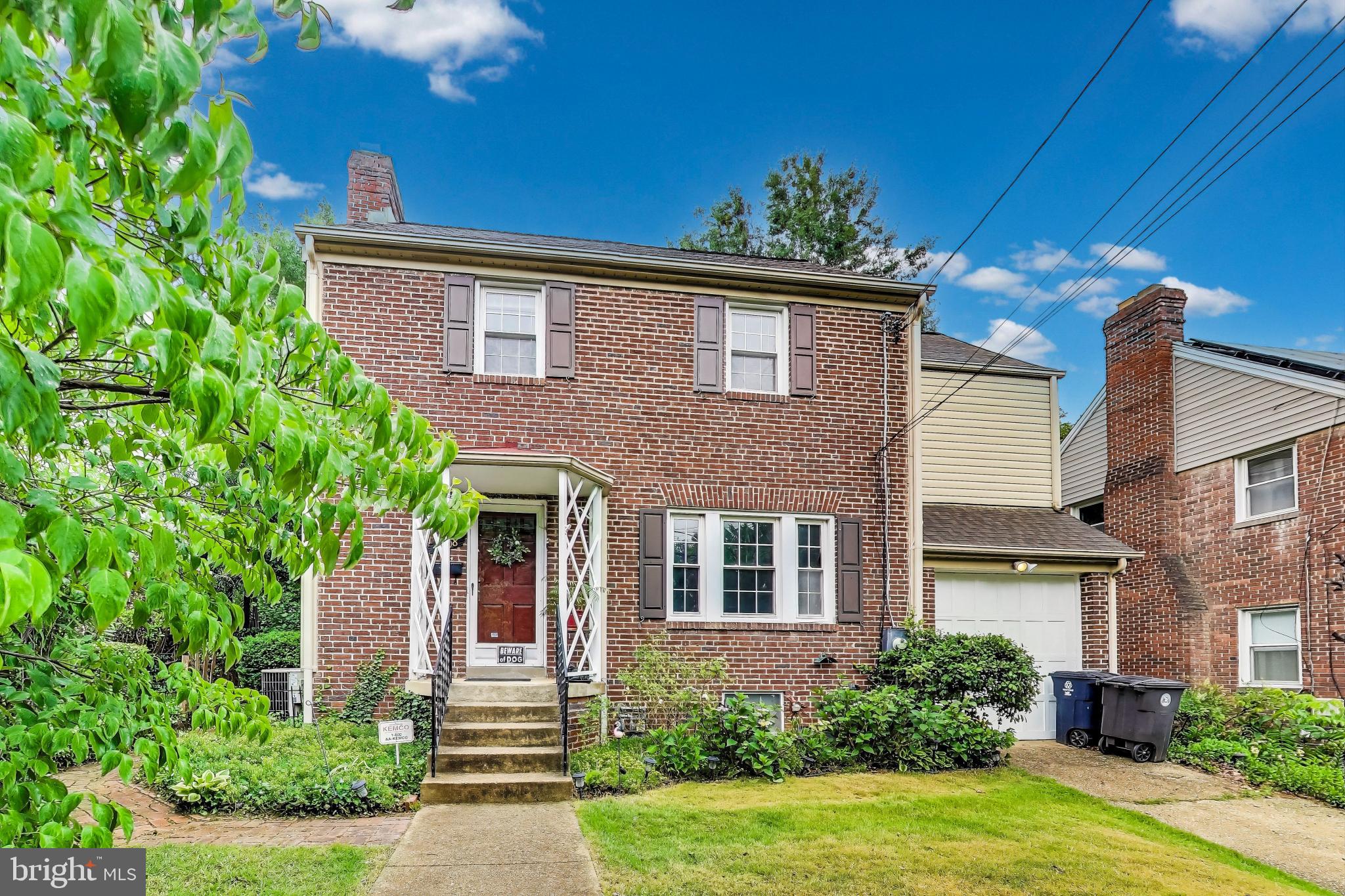 Nestled on a one way street where charm and character bloom like the azaleas out front, this classic solid brick colonial is more than just a house — it’s a home with heart, history, and heaps of potential.
Step inside and feel the warmth — hardwood floors (just newly refinished!) dance across the main and upper levels, guiding you from a spacious living room (with a crackling wood-burning fireplace perfect for cozy evenings) into a dreamy, fully-renovated eat-in kitchen where style and function shake hands like old friends. Envision timeless white shaker cabinetry, polished marble countertops, a tile backsplash, graceful pendant lighting, and a thoughtfully designed peninsula ideal for effortless entertaining. Off the kitchen, a private, enclosed back porch awaits (with newly installed LVP flooring)— the perfect perch for your morning coffee or evening unwind. Upstairs, discover three remarkably roomy bedrooms, each with its own ceiling fan and sunny disposition. A full bath with a tub and a hall linen closet round out the top floor with ease and elegance. The waterproofed basement is full of promise — great headspace, a half bath, laundry area, and all the flexibility to create your ideal hangout, hobby nook, or storage haven. Outside, the generous fenced-in backyard is a botanical love letter — thoughtfully landscaped with flowering trees, colorful blooms, and lush ground cover. Whether you’re entertaining friends or fireflies, this yard is your own private Eden. And let’s not forget the attached one-car garage and concrete driveway — rare treasures in this area! All this is located just steps from the vibrant energy of Historic Hyattsville, where neighbors wave hello and everything you need is close at hand. Stroll to local cafés, art galleries, breweries, community parks, the Arts District, the West Hyattsville & Hyattsville Crossing Metro Stations. You're minutes from Whole Foods, Busboys and Poets, Franklins, and trails that connect to the Anacostia River.