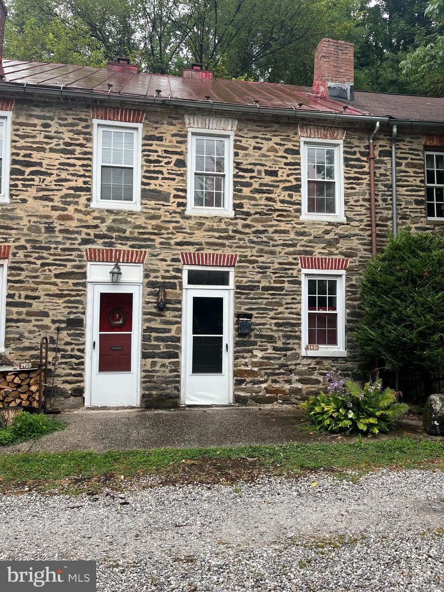 Vintage Stone Mill home in Jones Falls Valley.  Country like setting in the middle of the city nearby the artesian shops of Clipper Mill, great restaurants, the Woodberry Light Rail Stop and Falls Road.  
Two bedroom, one bathroom with a long stable rental history and great potential for renovation to preserve and update the historical and property value of this charming, unique home.