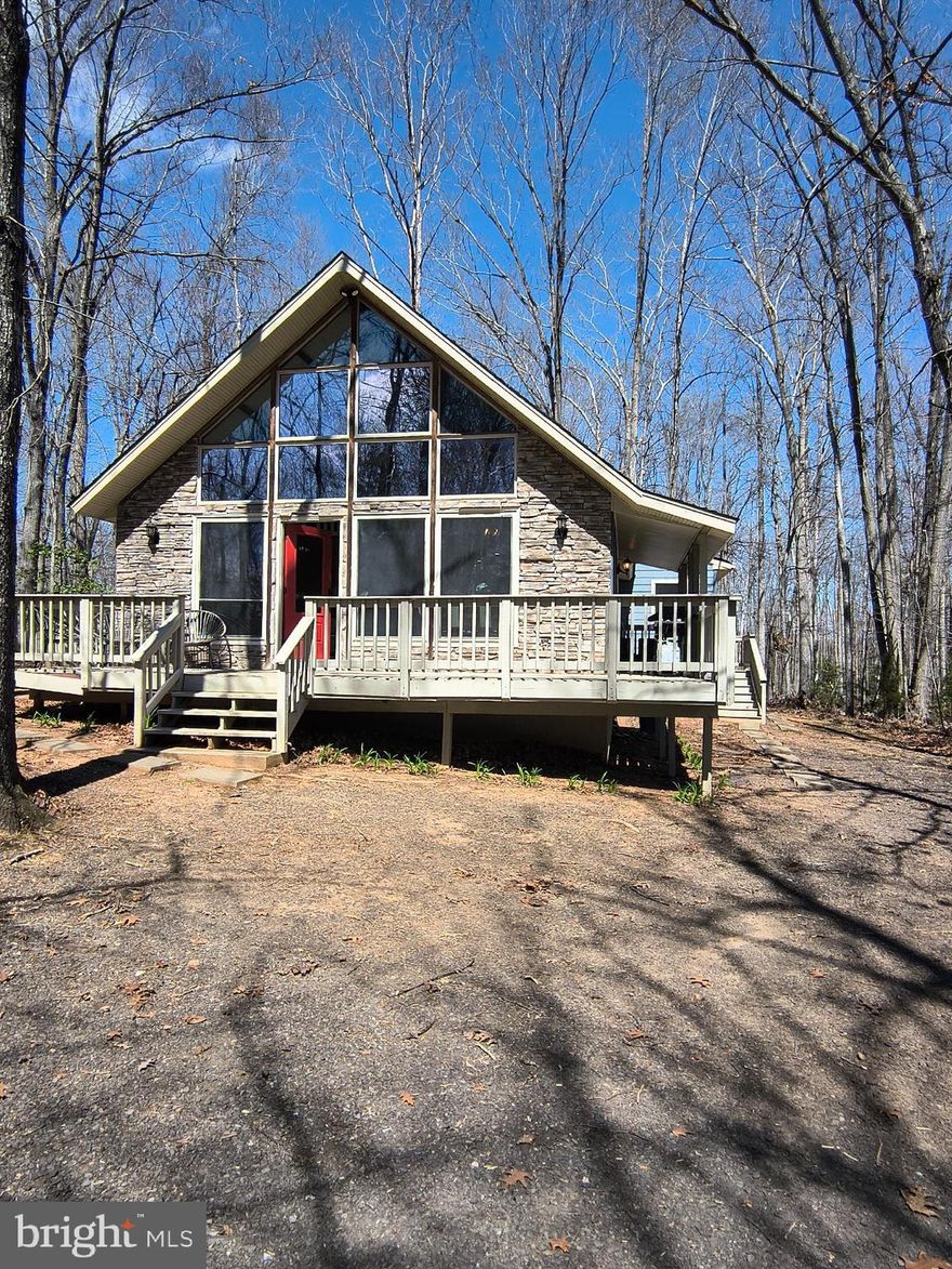 "Listing Announcement!!"
The owner will be reviewing all offers and making a decision for ratification on Thursday, April 10th, 2025.
Agents, please note: The cut-off time for offer submissions is 5:00 PM on Thursday.
Submit your Best & Final offer — no escalations will be considered.

Charming A-Frame Retreat in Amenity-Filled Lake of the Woods!
Looking for the perfect getaway home? This original A-frame gem is waiting for your personal touch! This home offers character and potential, featuring a striking stone front, newer windows, and a roof and addition added in 2005.
The primary bedroom boasts sliding doors to a screened porch, while the second bedroom/sitting room opens to a spacious back deck. Additional rooms provide flexibility for an office or extra living space, plus a spacious loft that spans half the home—perfect as a third bedroom, guest area, or bonus living space. Storage won't be an issue with plenty of closets throughout. The open floor plan is highlighted by a stunning floor-to-ceiling stone wall and a newer gas stove, creating a cozy atmosphere.
Located just a short walk from Cornwallis Beach, you'll enjoy fishing, swimming, and picnicking close to home. Lake of the Woods is a vibrant, amenity-rich community offering boating, kayaking, fishing, walking trails, parks, and nine beaches. Additional perks include an equestrian center, two in-ground pools, a fitness center, a golf club with a grill & bar, and a clubhouse restaurant with a sports bar. On-site security, a campground, and picnic areas add convenience and appeal.
Nestled between Fredericksburg and Culpeper, this home offers the perfect balance of tranquility and accessibility. Don’t miss this incredible opportunity—schedule your showing today!