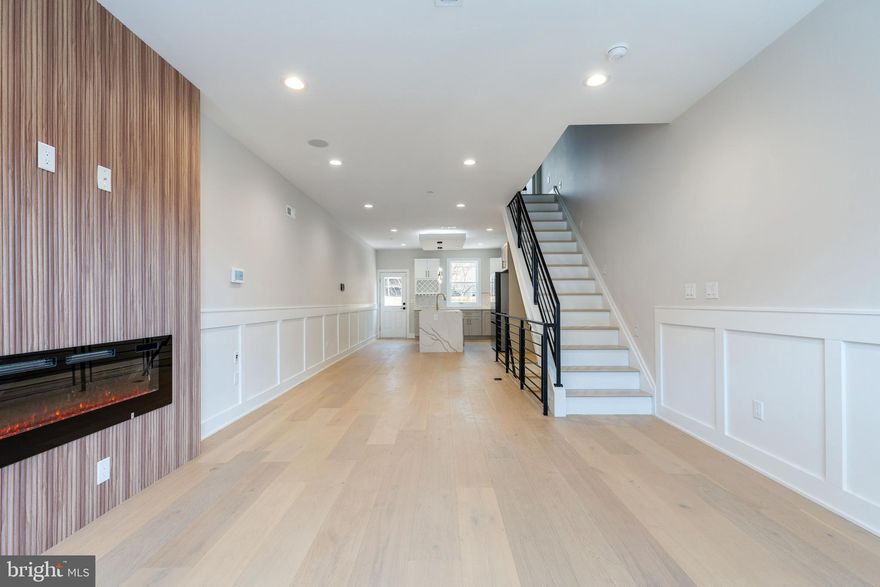 This stunning new construction 4-bedroom, 3-bathroom home offers modern sophistication in one of Philadelphia's most sought-after neighborhoods, POINT BREEZE. If you are looking for meticulous attention to detail, an approved 10 YEAR TAX ABATEMENT, a 1 year BUILDERS WARRANTY, and trendy finishes then this is the house for you! Entering through the front door you are greeted by gleaming wide plank, white oak hardwood floors, an electric fireplace with wood accent wall, wainscoting throughout the first floor, bluetooth speakers and a wide open floor plan. The dining space flows seamlessly into the kitchen which features a waterfall island with quartz countertops, marble backsplash, gold fixtures through out, upgraded stainless steel appliances with gas burner range, wine rack, two toned cabinets, and much more.  Head out the backdoor to a large paved patio enclosed with wood fencing perfect for entertaining on a warm summer evening. The 2nd floor includes two SPACIOUS bedrooms with a convenient laundry closet and beautiful guest bathroom. Taking the stairs to your private third-floor primary suite you'll be greeted by a gorgeous wet bar with quartz counter tops, sink, wine fridge, accent lighting and wall. Entering the room you'll find a his and her closet with large primary bedroom which has a painted accent wall, tons of natural light, and bluetooth speakers. Walking through the hallway and into your ensuite bathroom you'll find a double vanity sink, linen closet, serene soaking tub, and a fully tiled his/her shower with gold showers heads and sliding shower glass doors! Entertain in style on your private roof deck with skyline views that do not disappoint. Last but not least, a fully finished basement includes an additional bedroom and bathroom - perfect for guests/in-laws or a home office along with extra storage in the utility closet. 

Situated in the heart of Point Breeze, this home puts you minutes from top-rated restaurants like American Sardine Bar, cafes, and parks. Enjoy easy access to public transit, I-76, and major highways, with Fitler Square and Schuylkill River Trail just a short walk away. The vibrant neighborhood offers boutique shopping, fitness studios, and nightlife options all within a 10-minute radius. Don't miss this rare opportunity to own a move-in ready smart home in one of Philly's hottest areas - schedule your showing today!