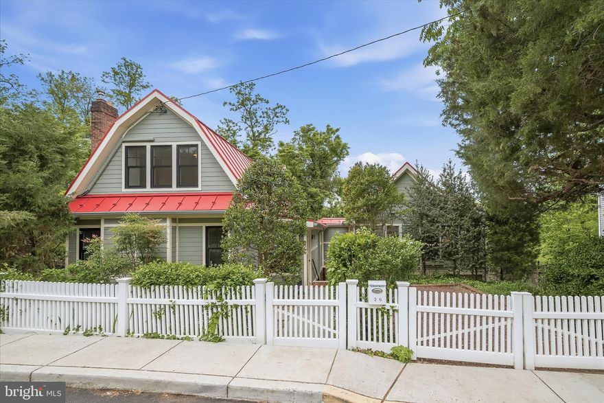 Nestled in the charming Town of Glen Echo, this delightful bungalow blends the timeless character of a 1903 Chautauqua Cottage with thoughtful modern updates.

Inside, a light-filled floor plan features high ceilings, wood floors, a wood-burning fireplace, and a wall of windows offering a winter view of the river. The dining room opens to a deck and flagstone patio, creating an easy indoor-outdoor flow. The table-space kitchen includes white cabinetry, granite countertops, stainless steel appliances, and a convenient pantry.

A more recent addition expands the home with a spacious family room featuring vaulted ceilings and abundant natural light. The main level also includes a laundry area and a private primary suite with vaulted ceilings and an ensuite bath with marble-top vanity and tile shower.

Upstairs are two generously sized bedrooms with ample closet space and a full bath. The lower level offers a bright finished studio with a new vanity sink—ideal for an art studio, office, or potential guest suite—as well as an unfinished area for additional storage.

Outside, the fully fenced yard includes off-street parking, a Level 2 EV charger, extensive hardscaping, stone retaining walls, a flagstone patio, and a sunny upper deck—perfect for relaxing or entertaining.

Glen Echo offers a vibrant, close-knit community with holiday parties and pot-lucks at the Town Hall, a community garden, Little Free Library, and easy access to nearby trails. Ideally located near Glen Echo Park, the C&O Canal, and Cabin John Creek, with convenient access to Bethesda, DC, VA, I-495, and I-270.

Zoned for highly regarded schools including Bannockburn Elementary, Thomas W. Pyle Middle, and Walt Whitman High School.

Freshly painted and updated with a newer metal roof, windows, Hardie Plank siding, and two-zone HVAC, this move-in ready home offers the perfect blend of charm, comfort, and community.