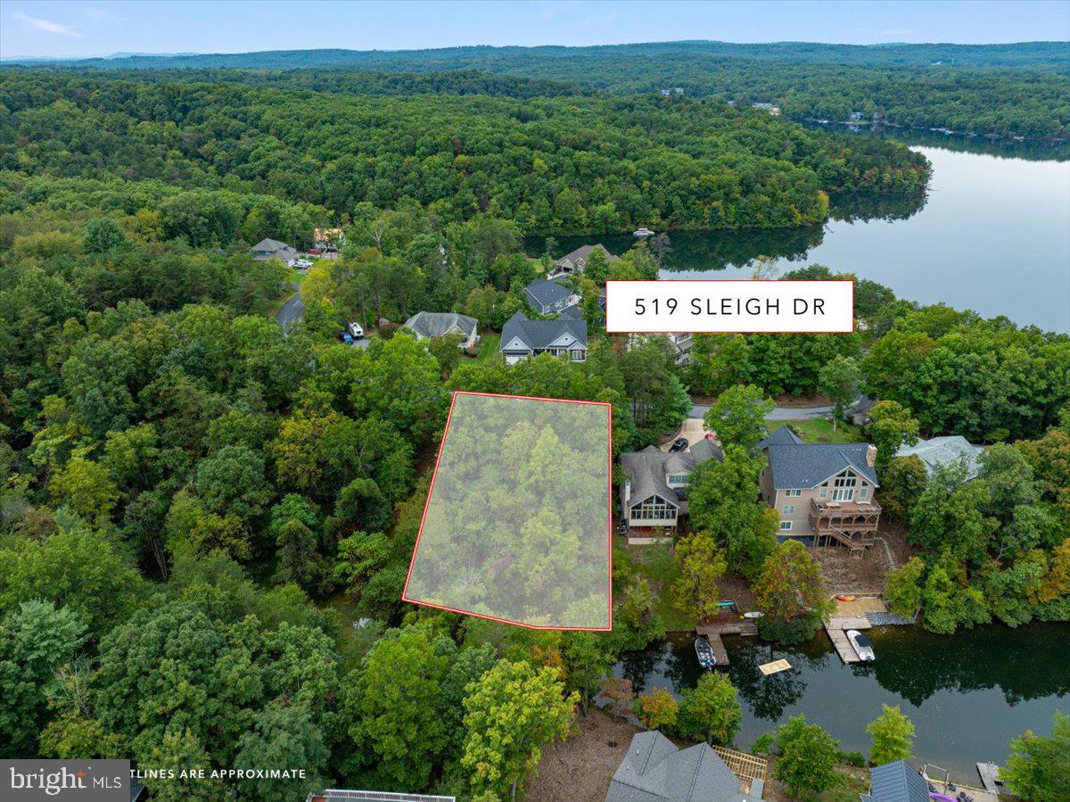 Potential waterfront lot for your dream lake house! There are very few waterfront lots left in Lake Holiday, and this one is very affordable due to the steepness of the lot, so put your thinking caps on and come visualize your new lake home! Just steps from beach 2 and the amenities located there, as well as tons of walking trails. The south side of the lake is super quiet and yet easy to get to from the front gate for commuting! Lake Holiday is home to a 240 acre private gated lake with three beaches, sports courts, disc golf, dog park, clubhouse with exercise room, game room, and more! Still the best kept secret in Virginia, so come explore the possibilities! This lot is at the end of a cove so buyer will need to verify if there is enough water to meet their needs. Water and sewer tap fee is only $5k! Buyer to verify amount of water frontage and water depth, seller makes no representations as to water frontage or ability to install a dock or ability to boat to/from lot. Survey is available!