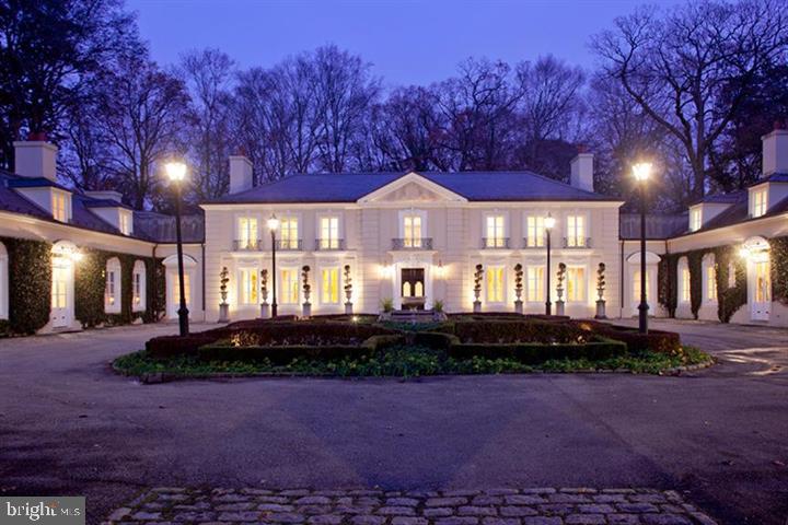Nestled behind its majestic gates, this Bryn Mawr Estate, graced with a charming courtyard, unveils an oasis of serenity amidst stunningly landscaped grounds. A haven of privacy, yet conveniently close to the allure of The Main Line, Center City Philadelphia, and transportation hubs, including Acela Trains and Philadelphia International Airport. Meticulously transformed by its current owner, every detail of this residence exudes exquisite craftsmanship and timeless elegance.
Inspired by the luminous design of La Lanterne in Versailles, renowned for its interplay of light akin to a lantern's glow, this home captures the essence of illuminated grandeur. Sun-drenched rooms, adorned with floor-to-ceiling French doors, offer enchanting views of the sprawling gardens, suffusing the interiors with a warm radiance.
The magnificent drive leading to the estate is a picturesque avenue, flanked by centennial Linden trees, offering a majestic entrance to this architectural masterpiece. With 12-foot ceilings enhancing the sense of grandeur, the space seamlessly accommodates both grand gatherings and intimate family moments.
Awaiting its final touch, gourmet kitchen and family room area promises to elevate the culinary experience. The luxurious Master Suite, adorned with marble bath and a domed ceiling sitting room, provides a sanctuary of indulgence. Six additional bedrooms, ideal for office space or guest retreats, complemented by seven full bathrooms and two powder rooms, ensure comfort and convenience.
Further enhancing the estate's allure are amenities such as an attached 6-car garage, a tennis court with a pavilion, and a natural stream-fed pond, harmoniously blending with the verdant gardens. Poised on an expansive 5.82-acre lot along a prestigious restricted lane, this treasure awaits those seeking the epitome of refined living.