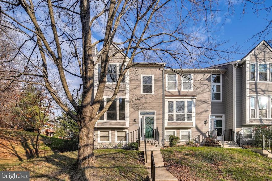 Must see totally remodeled end unit  town home in sought after Woodland Village, Ellicott City! Endless improvements include: new roof (2016); new HVAC (2014); remodeled eat-in kitchen w/Quartz counters, new cabinets, upgraded stainless steel appliances and subway glass tile backsplash; gleaming wide planks throughout the main floor; living room w/warm wood burning fireplace; open dining room w/bright box window bump-out; 1st floor powder room w/pedestal sink; upper level w/3 bedrooms and 2 full remodeled bathrooms w/custom tile work; fully finished lower level w/walk-out, expansive recreation room, laundry closet, 4th bedroom and 3rd full remodeled bathroom; freshly painted w/designer colors; brand new carpeting; endless recessed lighting; 2 level rear deck w/staircase to yard! Premium lot sides to woods! Includes community pool, tennis, playground and open space. An amazing location minutes to Rt 100, I-95, Ft Meade and major commuter routes!