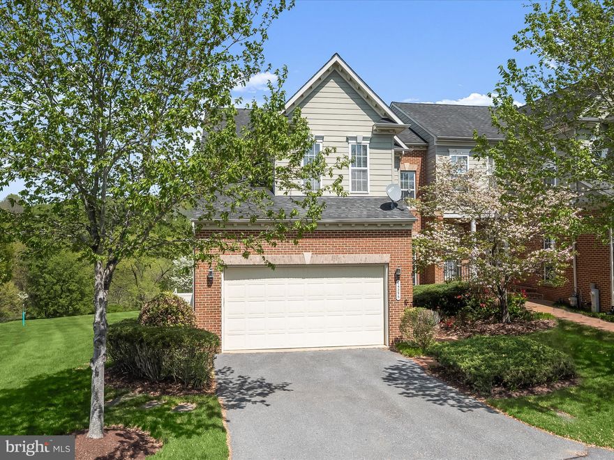 This expansive, light-filled end-unit home is located in the Villas at Cattail Creek — a vibrant 55+ active adult community! Offering over 4,000 square feet of  finished living space across all three levels, this home provides full main-level living plus a separate, independent living area on the lower level.

The main level features gleaming hardwood floors throughout. A private office with French doors and built-ins offers the perfect space for work or study. The spacious kitchen, boasting a bay window, offers expansive cabinetry, a separate pantry, breakfast bar, center island, updated double wall oven, and a gas cooktop. Conveniently connected to the mudroom and laundry area, the kitchen also provides direct access to the attached two-car garage. A separate dining room area with bay window and an inviting living room centers around a cozy gas fireplace, while the stunning two-level sunroom addition showcases Palladian windows and a sliding door leading to the composite deck — perfect for drinking your morning coffee overlooking the open space. 

The main-level Primary Suite features a walk-in closet and a spa-like bath complete with a soaking tub, separate shower, water closet, and double sinks.

Upstairs, you'll find an expansive loft area and two generously sized bedrooms with an adjoining full bath, along with additional storage space.

The fully finished lower level offers fantastic flexibility, featuring a complete independent living area with a separate bedroom, full bath, full kitchen, washer and dryer, and a comfortable living room with its own gas fireplace — ideal for guests, hobbies, caregiving needs, or creating your own private retreat. There’s also convenient walk-out access to the rear yard.

Located just around the corner is the amenity-filled Cattail Creek Country Club (with a variety of membership options), offering a golf course, tennis and pickleball courts, outdoor pools, fitness center, and a newly renovated clubhouse and restaurant.  Some photos have been virtually staged