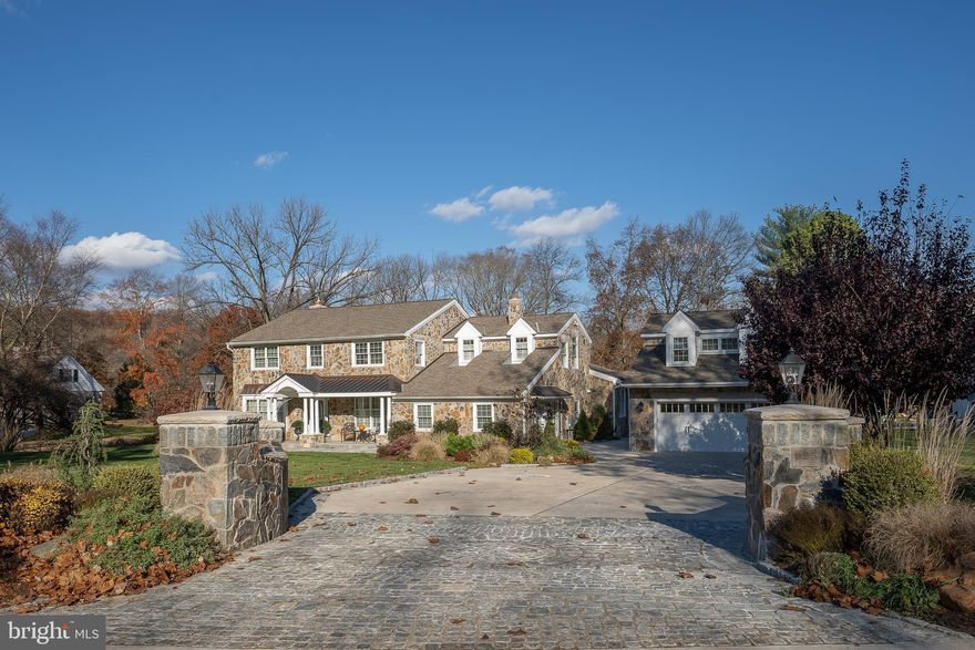Welcome to 925 Hunt Road in Radnor Township! Situated prominently on a nearly one acre level parcel, this solid stone colonial home has undergone extensive improvements with the finest quality and craftsmanship. With four bedrooms (including an expansive primary suite) and three full baths, it also consists of many bonus spaces including a first floor office, large side-entry room that could become a playroom or second office, game / family room that could be converted to an additional bedroom suite since it is adjacent to a full bathroom with a walk-in shower, and a large home gym above the detached two-car garage. You will find that the updated kitchen has an open floor plan into the living room, where there is a gas fireplace surrounded by natural stone. Additionally, there is a barn in the nicely landscaped rear yard that is perfect for storage. For enjoyment outdoors, there is a large composite deck featuring a gas firepit and grill area nicely framed by a beautiful pergola and outdoor lighting. This home has been constructed with an easily accessible crawl space instead of a full basement. Take the time to visit 925 Hunt Road to experience the exceptional quality of completed renovations in this home!
