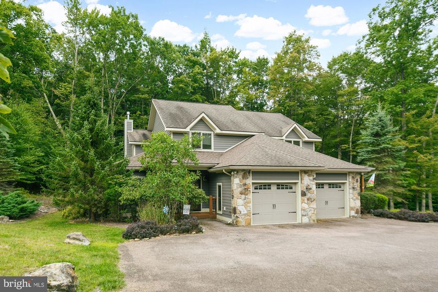 3BR, 2.5BA, 2200sf +/- luxury duplex at Mystic Creek. Incredible privacy - backs to 6+ acres of common area in a wooded setting off Lake Shore Drive. Close proximity to several state parks, Wisp Ski + Golf and local marinas. High end finishes, granite, gas fireplace, covered porch, 3 master suites, custom tile, attached garage & attractive floorplan, Well appointed, most furniture will convey.  Low condo fees cover virtually all of your maintenance & insurance.