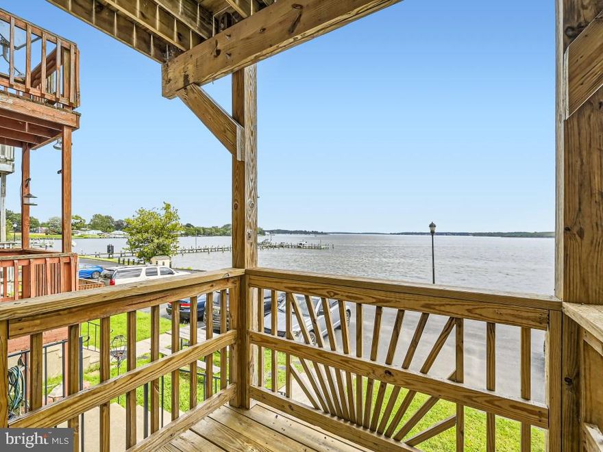 Welcome home - 3 levels of water view, off street private parking for 2 cars, community private pier access & option for you to store your boat!  This is living the dream.  Convenient to everything by land and water.   Your new home also features: a new roof, 4 x new slider doors ( 3 on the front over looking the water and 1 off the kitchen over looking the fully fenced back yard); a new storm door at the front entrance, new carpet in lower level family room overlooking the water which features a half bath, fireplace, and laundry level; new flooring on bedroom level; 3 updated bathrooms featuring new flooring,  vanities, and commodes, new kitchen cabinets and countertops, freshly painted and resealed front decks that were originally replaced with 4 years old.  If you are looking for relaxing & oasis to call home with water views, that is centrally / conveniently located, updated and well maintained, this is where your next chapter to begin... Welcome home!