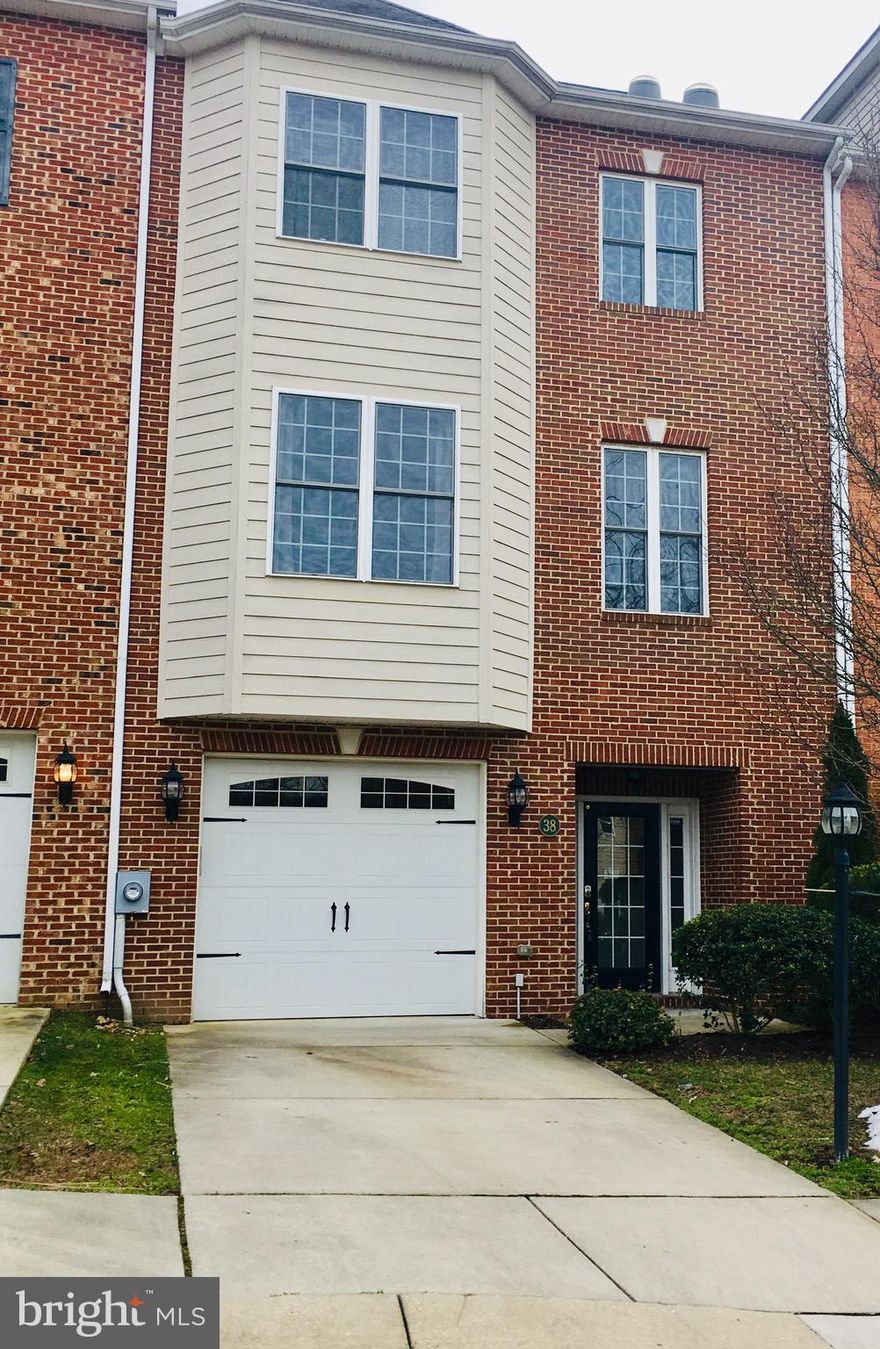 Beautiful 3 level (above ground) town home w/ hardwood thru entire house, main level bdrm w/ full bath, open living room, library w/ french door, open kitchen, butler's pantry, decking leading to brick paved patio, walking distance to town amenities. Spacious garage plus driveway, tons of upgrades!  **25 Architectural shingles **Closet for future elevator