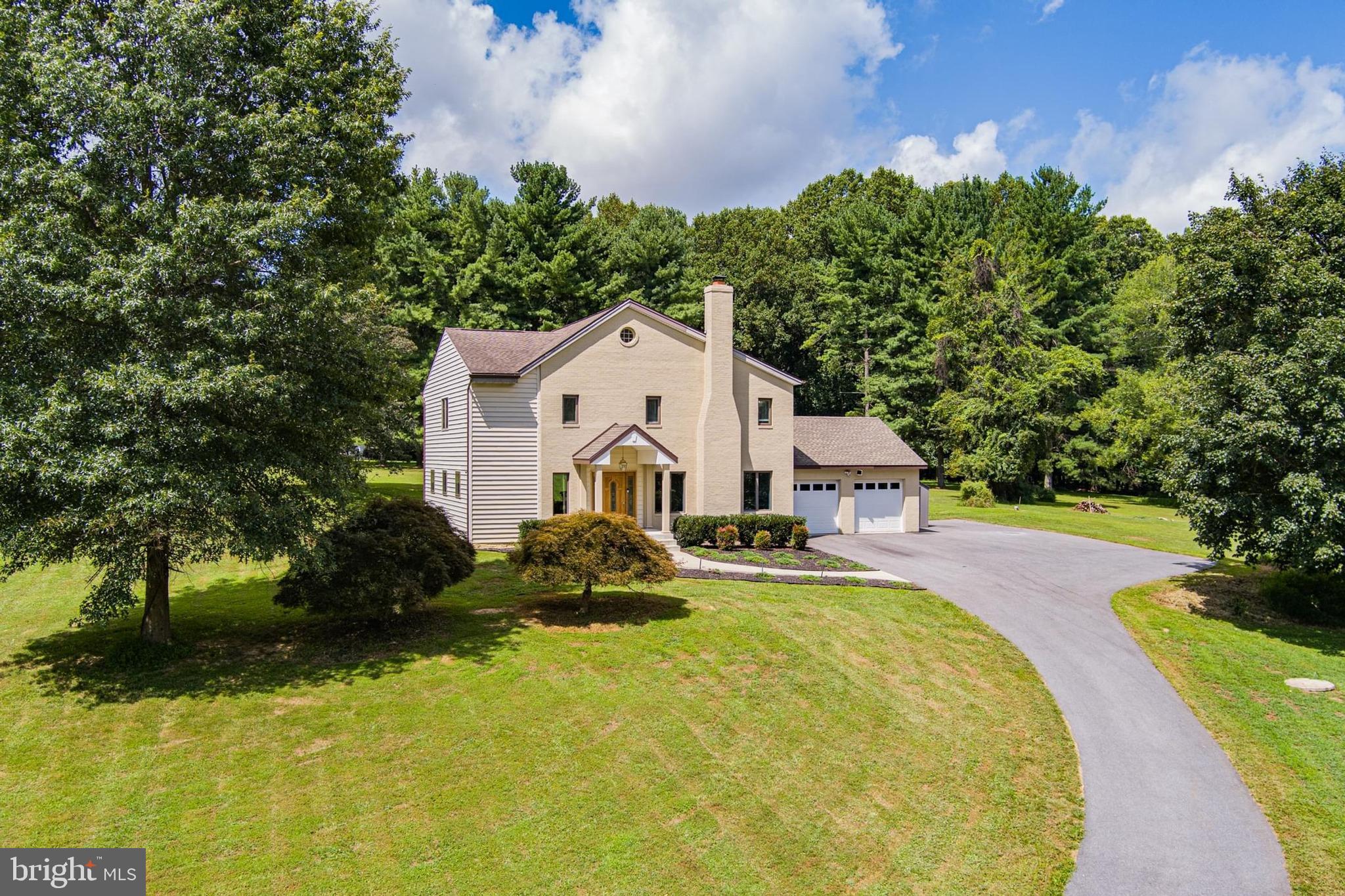 Nestled on 3 scenic acres, this beautifully updated home features 2021 upgrades including a brand-new private drive, covered front porch, Brazilian hardwoods, and a sparkling new kitchen with stainless steel appliances, custom cabinetry, and granite countertops. The open-concept layout flows to a sun-filled family room and rear deck overlooking a serene, tree-lined lawn. Upstairs, enjoy three private en-suite bedrooms—each with its own bath, sitting area, and hardwood floors. A cozy wood-burning fireplace, versatile living spaces, and peaceful countryside setting make it a must-see!