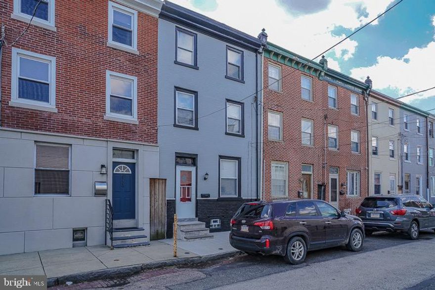 COVID 19 showing alert. Listing agent will sanitize and open door if  buyer wants to take a tour of this property .This adorable  home boasts 3 bedrooms and  1.5 Bathroom is tucked away on a quiet street in Port Richmond but close to all the major roads. Hardwood woods floors throughout the home, updated kitchen and bathroom as well. Parking is a huge bonus with rear yard entrance to your home.  Check out i95revive for future green space under the old I95 and along Richmond St behind the house.