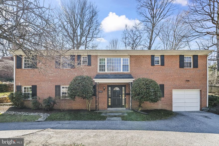 This elegant all-brick raised ranch in the coveted Rollingwood neighborhood of Chevy Chase offers 3,100 square feet of beautifully designed living space across two levels. The home has been well maintained and thoughtfully laid out to provide both comfort and flexibility. The lower level welcomes you with a spacious recreation room featuring a wet bar, along with a bedroom, full bath, utility and laundry rooms, and direct garage access. Upstairs, abundant natural light pours across hardwood floors, highlighting a seamless flow between the living and dining areas. The kitchen connects effortlessly to a sunroom that opens onto a professionally landscaped, low maintenance, and expansive backyard, perfect for enjoying the outdoors in every season. Two additional bedrooms and two full baths complete the upper level, creating inviting retreats with a sense of balance and privacy. The setting is just as appealing as the home itself. Residents enjoy close proximity to Rock Creek Park and its extensive trail system, offering miles of pathways for walking, running, or biking. Commuters benefit from easy access to the Beltway, downtown Bethesda, Silver Spring, and Washington, D.C., while nearby Metro stations provide further convenience. Parks, playgrounds, Meadowbrook Stables, and Meadowbrook Local Park are only minutes away, and a short drive leads to Bethesda Row with its mix of boutiques, dining, and entertainment. Combining classic architecture with sun-filled interiors and a coveted location, this home delivers a lifestyle that is both refined and connected, offering the perfect blend of indoor comfort and outdoor enjoyment. Mortgage savings may be available for buyers of this listing.