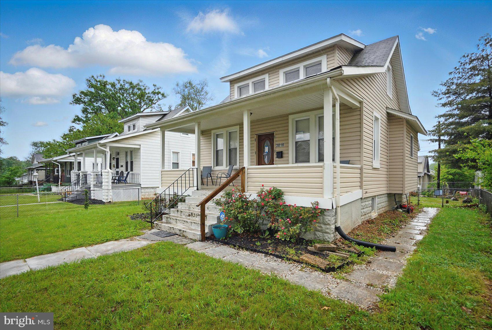 Adorable 3BR/3BA Craftsman style home on a quiet street in Howard Park. Step through the gated front yard, pass by a lush lawn and blooming shrubs on your way to the covered front porch of your new home. Step inside to an open concept main floor boasting beautiful hardwood floors, recessed lighting, and tons of natural light. The main floor features a large living room that is open to the spacious dining room, and stunning kitchen. The kitchen features plenty of cabinets including a pantry cabinet, stainless steel appliances, granite countertops with a complimenting backsplash, a stainless sink under the window, and an island with pendant lights and breakfast seating for three or more. The main floor is not complete without a spacious bedroom and a full bath. The second floor offers two similar sized bedrooms each with a large closet, and a full bath with a stand-alone shower. The lower level features additional living space with luxury flooring, a full bath, a spacious family room, laundry, storage, and a walk-out to the spacious fenced yard. From the kitchen step outside to a yard filled with so many possibilities, and offers an off street parking pad. This home is ideal for any new homeowner and is located in close proximity to shopping, restaurants, and commuter routes.