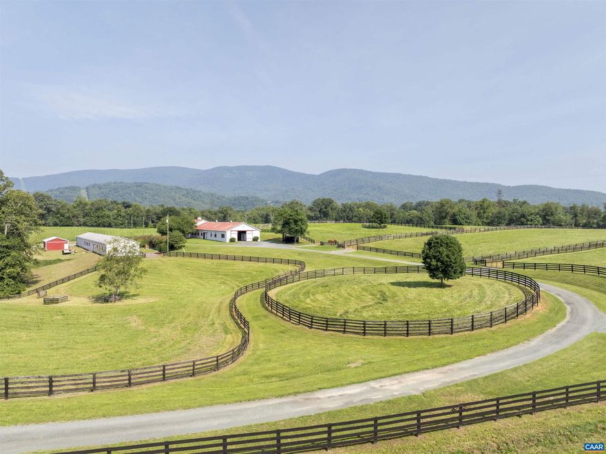 Exceptional horse operation near the town of Crozet.  Large center aisle stable and secondary yearling barn and shop building. Fenced and cross fenced with 4-board fencing.  Private setting with good mountain views.