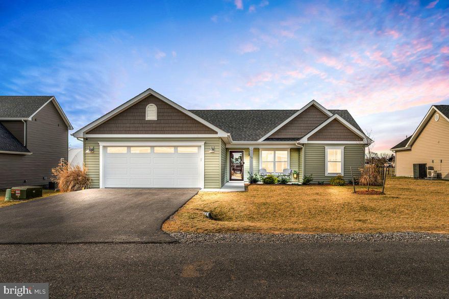 Built in 2023, this nearly new home in Harvest Glen offers stylish, low-maintenance living in a tucked-away yet convenient location. Thoughtful finishes include LVP flooring, a ceramic tile backsplash, and quartz countertops. The open, one-level layout features wide doorways, a custom-tiled walk-in shower with a glass door in the owner’s suite, and covered front and rear porches. Enjoy a fenced backyard and modern comfort in this move-in-ready home!