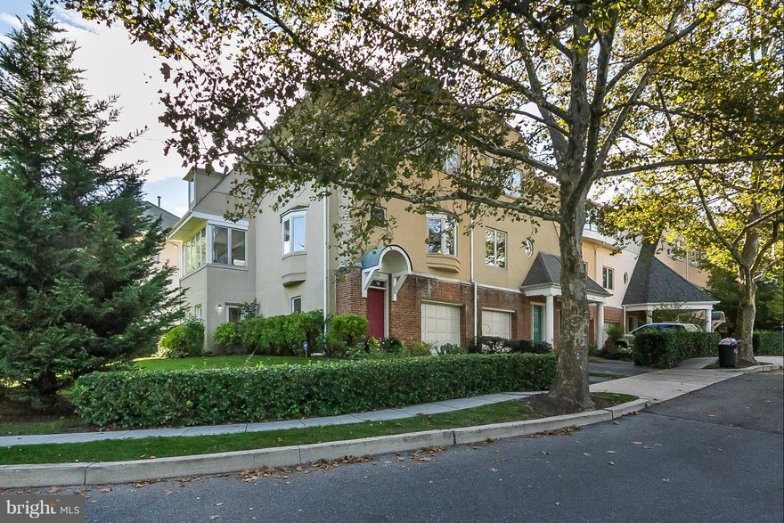 Stylishly renovated large END OF GROUP!  Stunning designer eat-in kitchen, granite,stainless and has been opened to dining room .  1st and 2nd flr have bonus room /solariums.3 full baths, lge deck,landscaped corner lot.  2 master suites, walkin closets and sunlight throughout.  Gated community offering easy access to public transportation & local colleges & universities. A fabulous  home!